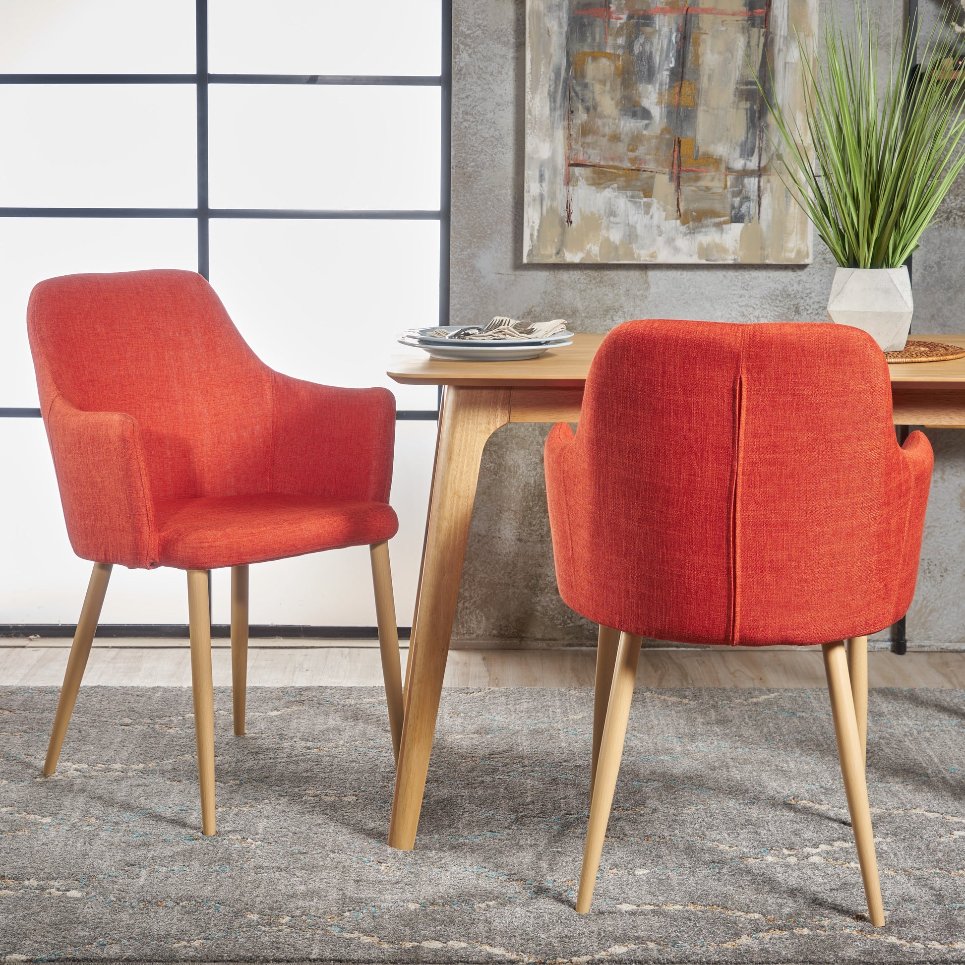 Orange fabric dining chair with light wood legs modern design