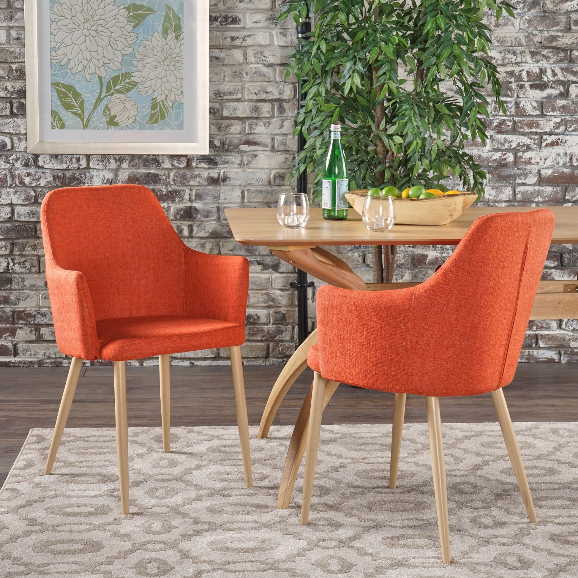 Armchair with orange fabric upholstery and light wood legs perfect for dining rooms