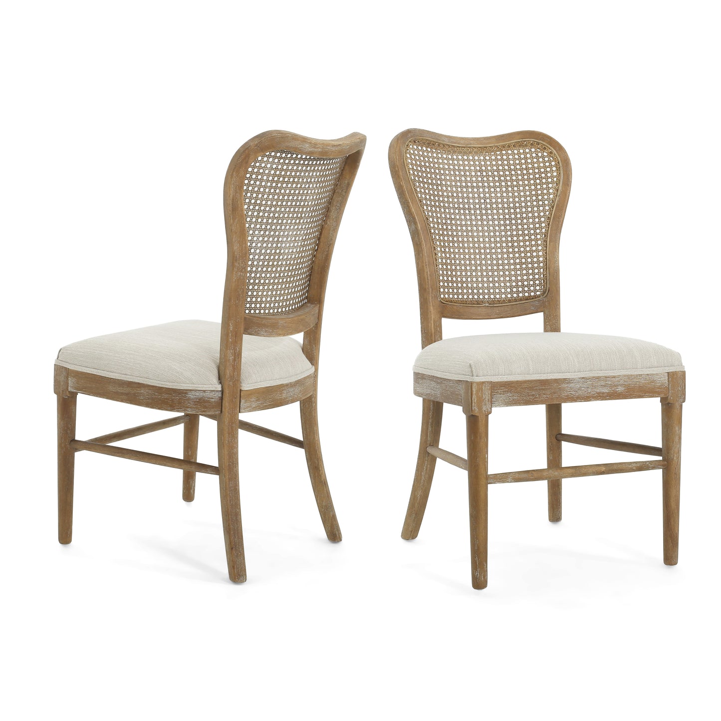 Two rustic wooden dining chairs with woven cane backs and neutral linen seats