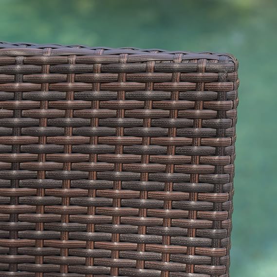 Closeup of dark brown woven wicker patio furniture texture detail