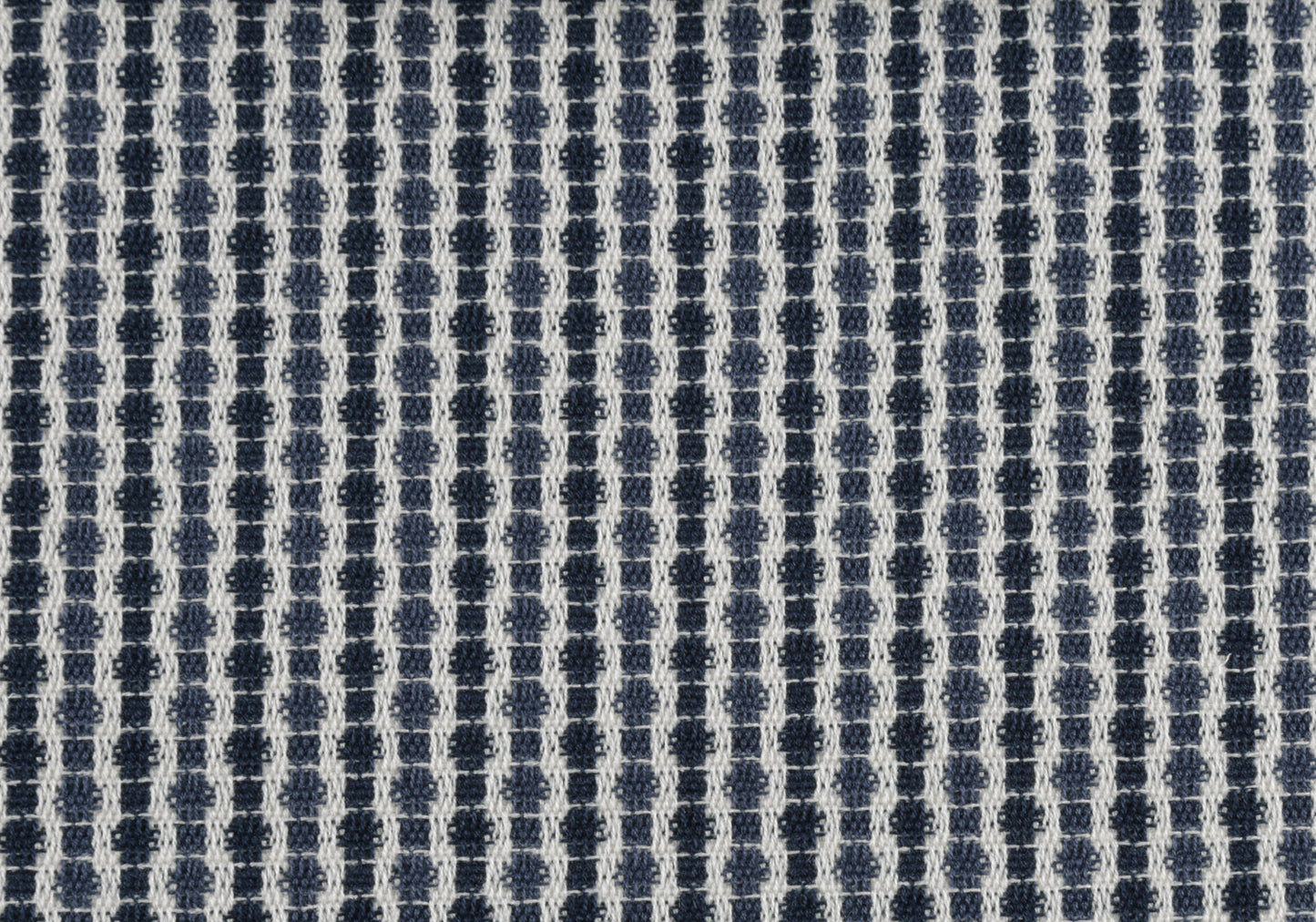 Closeup of textured blue and white geometric pattern fabric