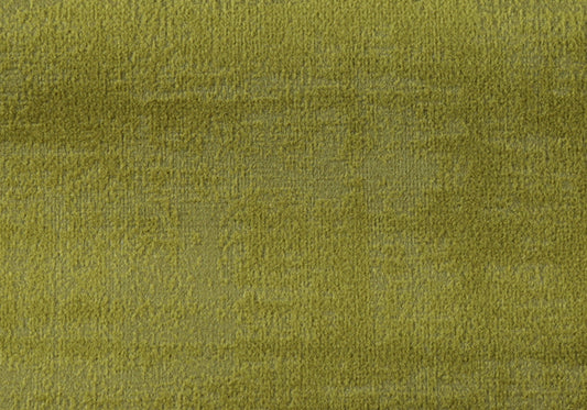 Closeup of plush lime green velvet fabric with a soft textured pile