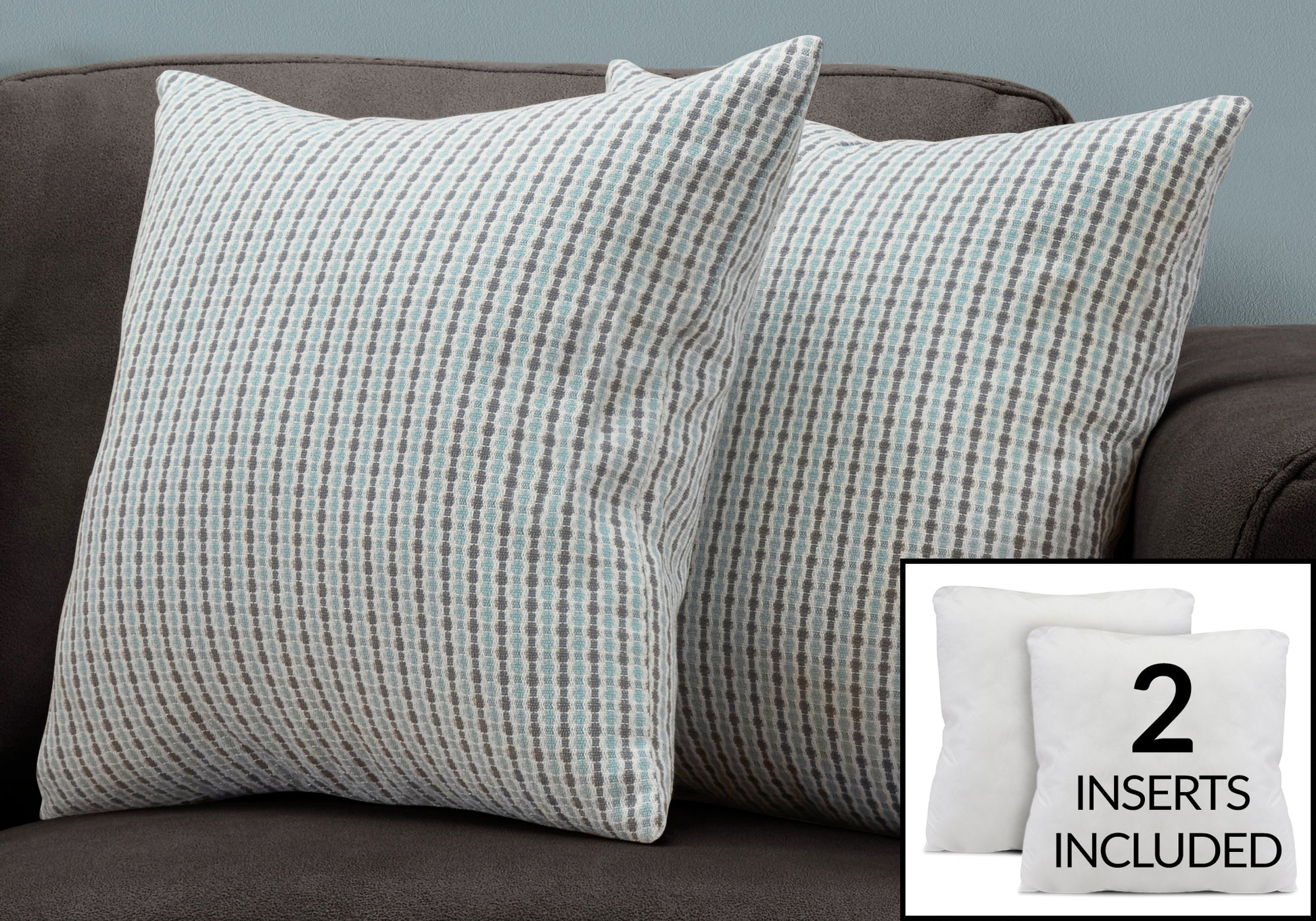 Two decorative throw pillows with a gray and blue geometric pattern on a couch
