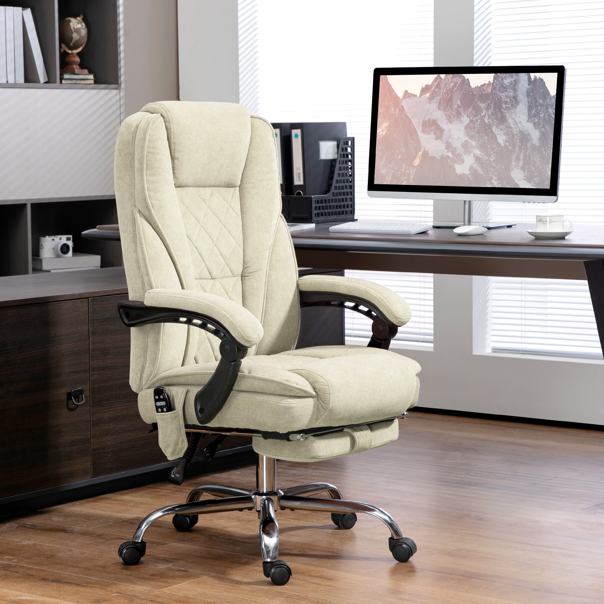 Beige executive office chair with builtin footrest and massage functions for ultimate comfort