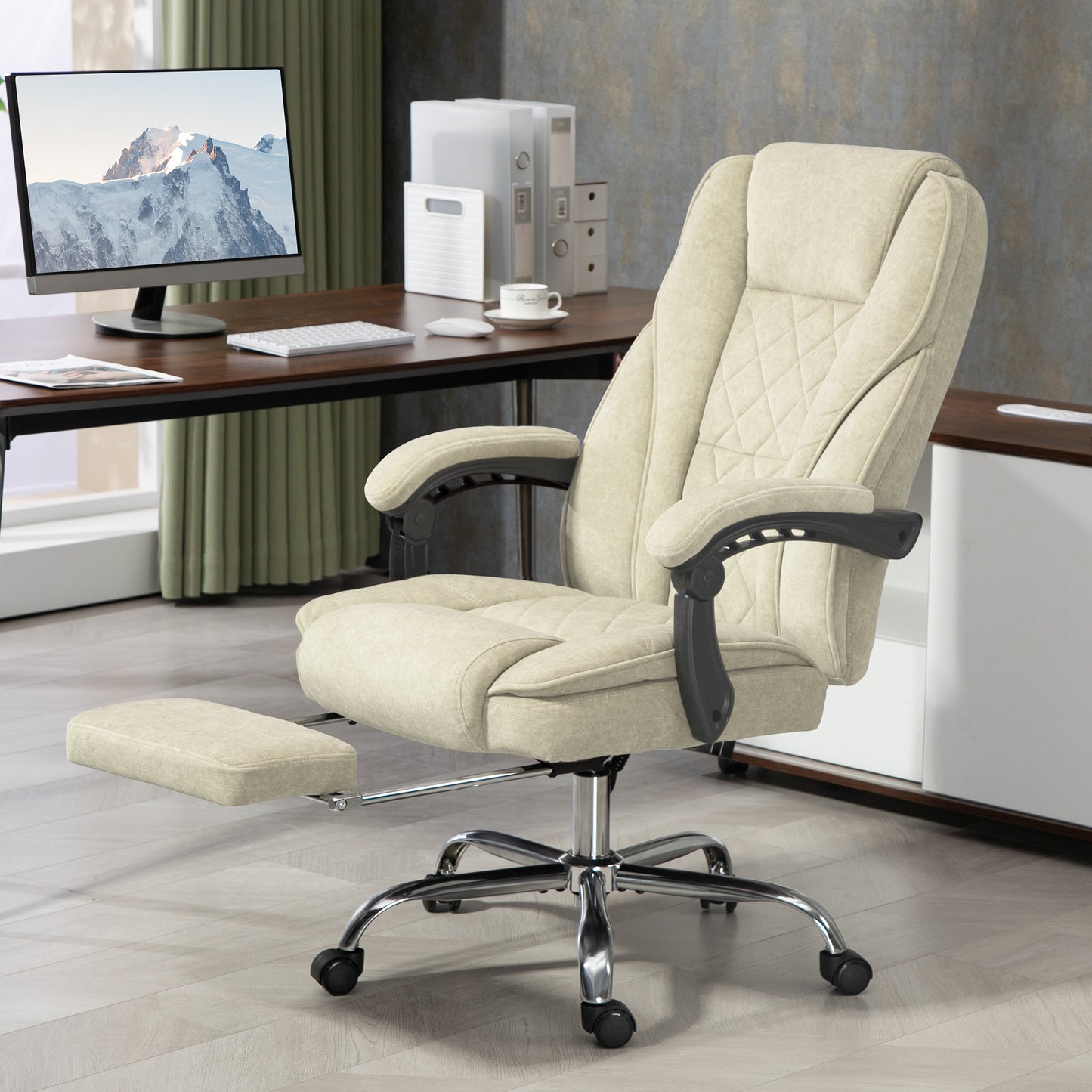 Cream upholstered office chair with diamond stitching and retractable footrest
