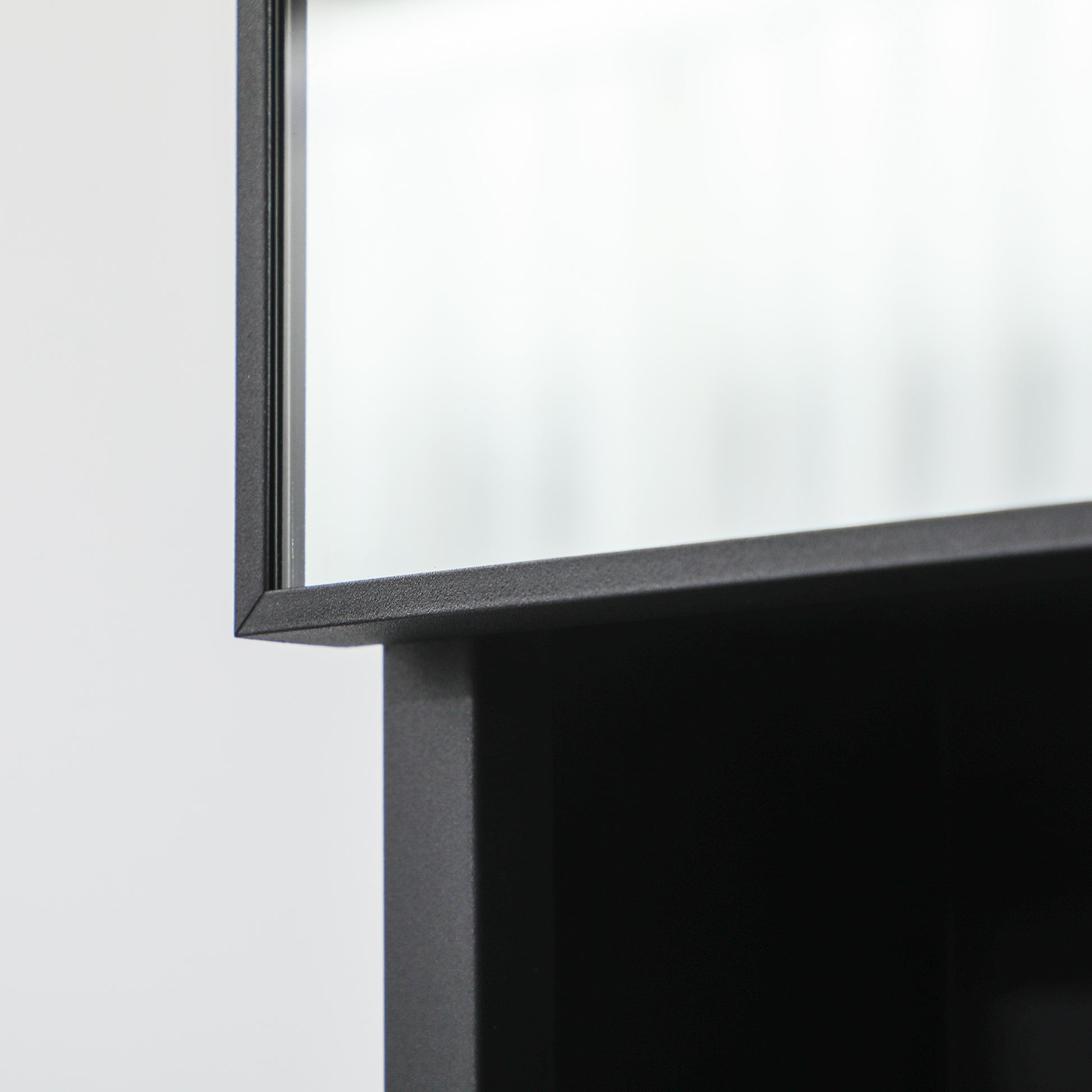 Black metal framed mirror with textured edge for modern decor