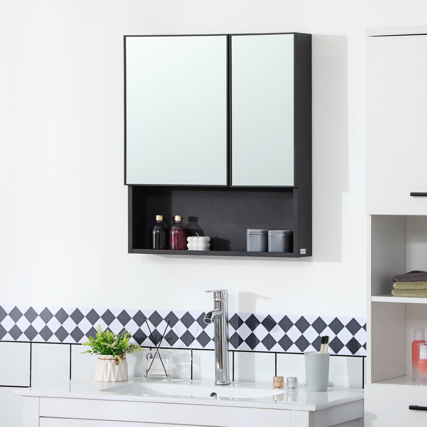Black dualdoor medicine cabinet with open shelf holding bottles and candle