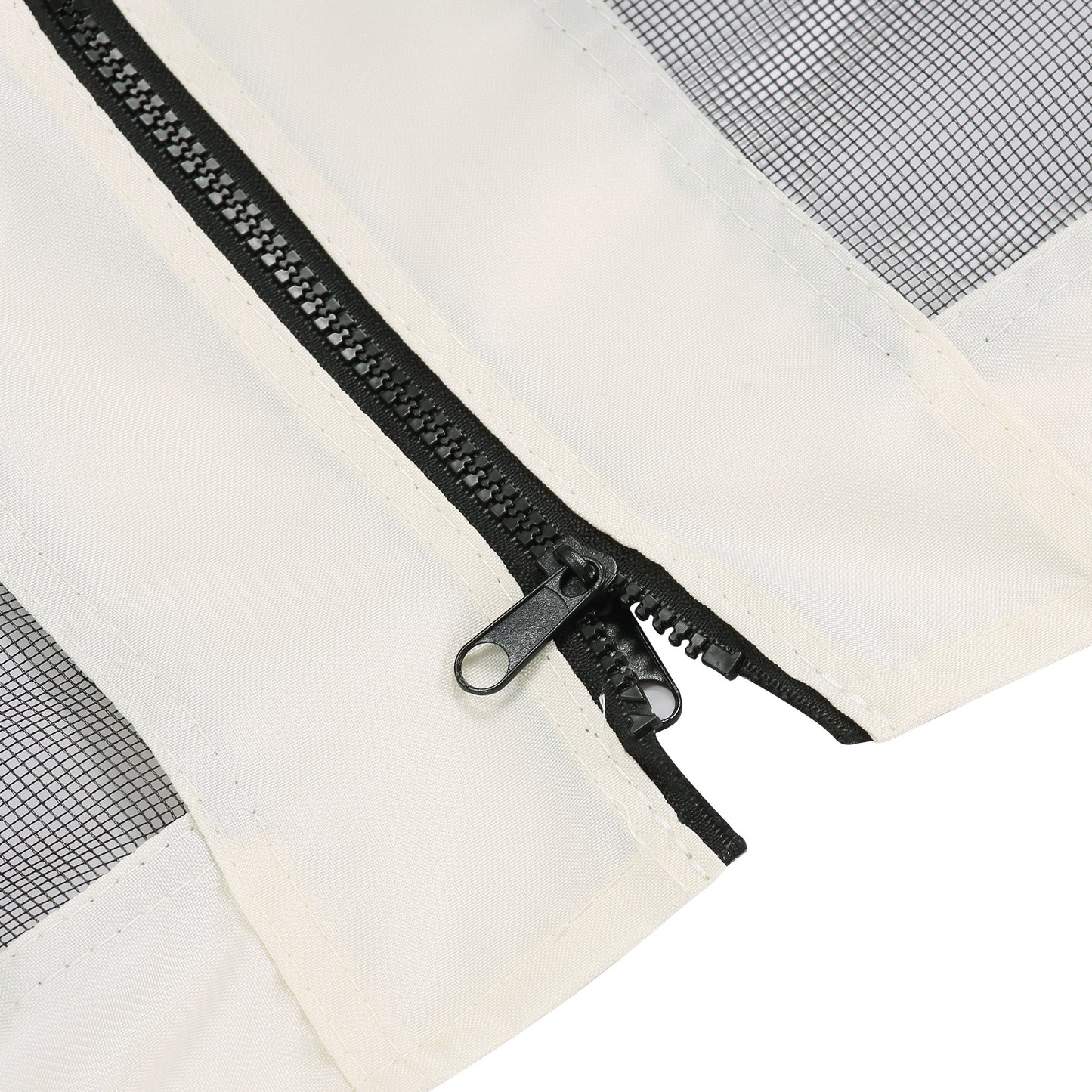 Closeup of a heavyduty black zipper on a cream canvas tent flap with mesh window