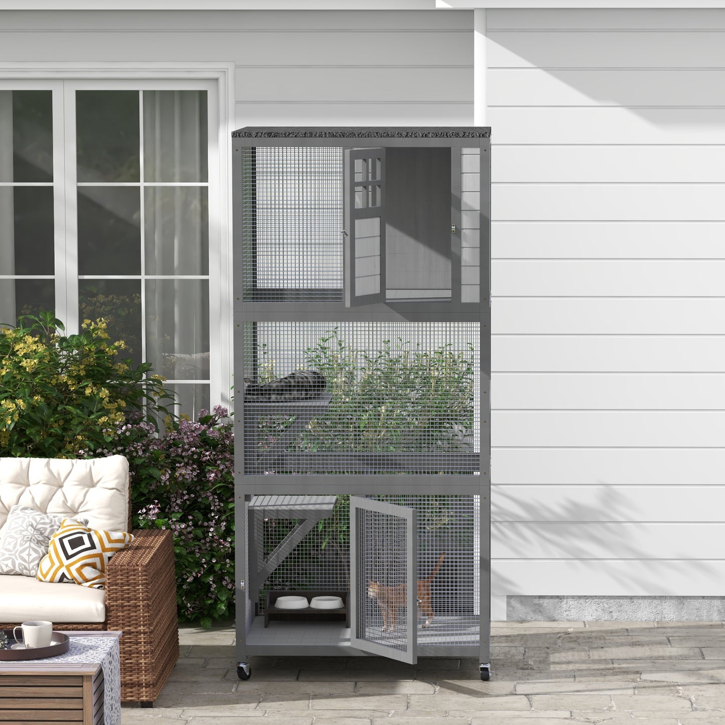 Gray outdoor cat enclosure with multiple levels platforms and open doors