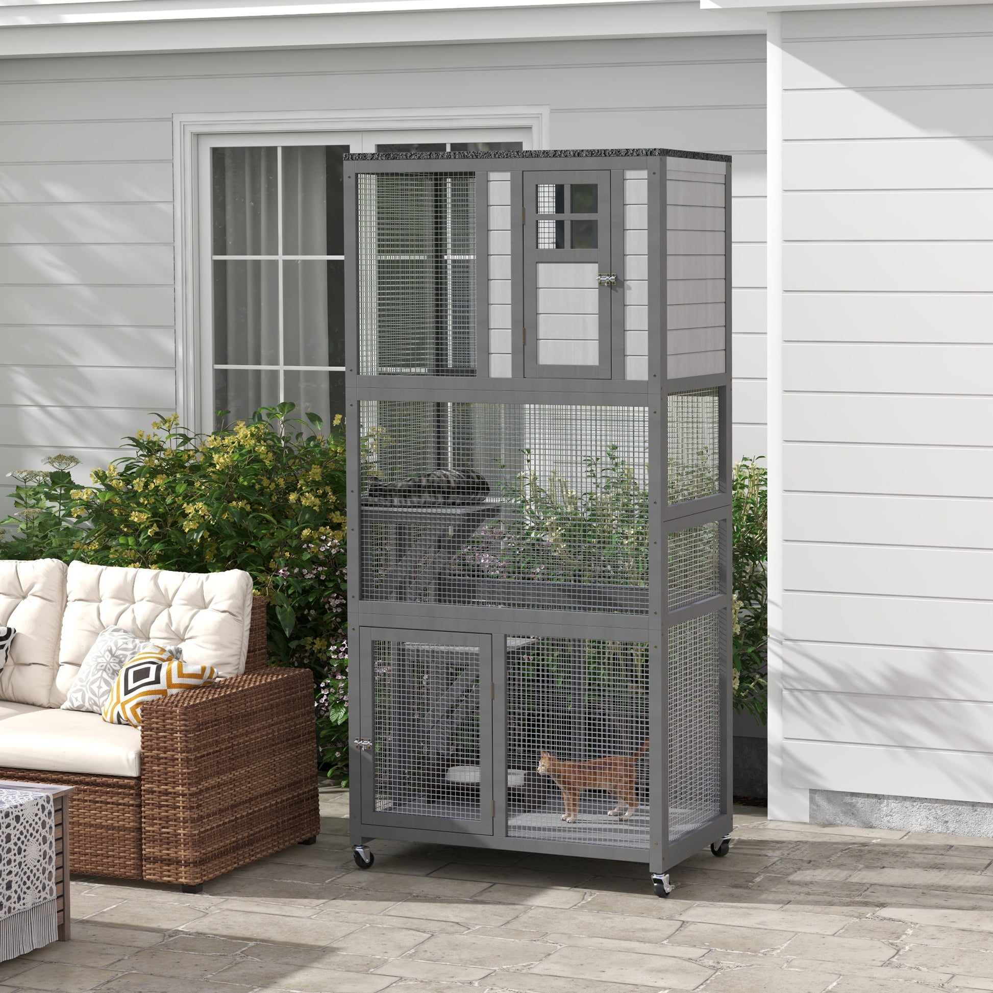 Gray multilevel outdoor cat enclosure with two cats visible