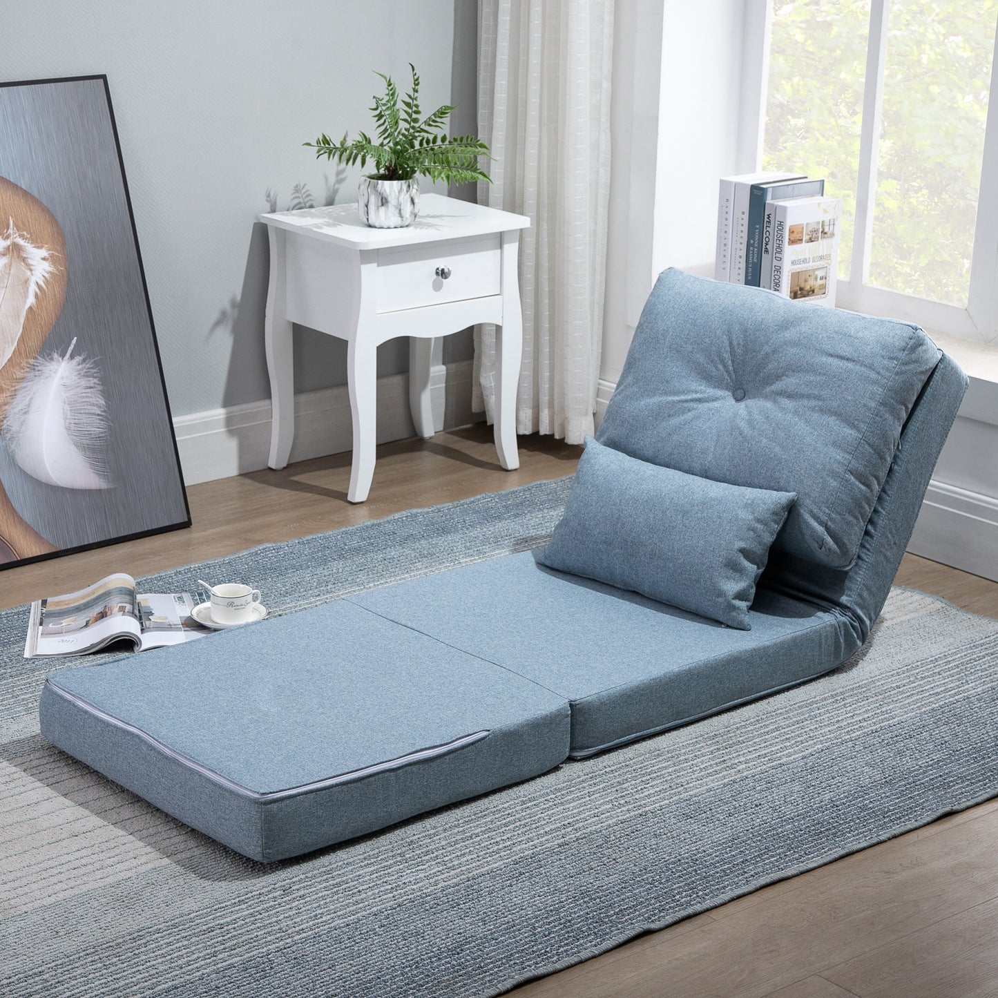 Blue linen futon sofa bed with adjustable back and included accent pillow