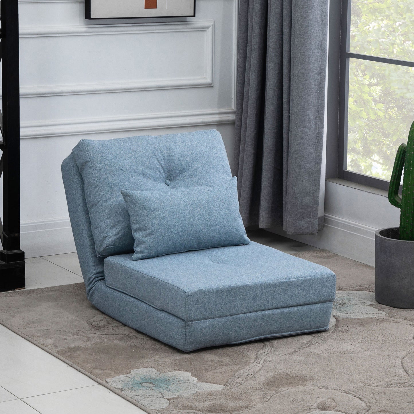 Light blue upholstered convertible chair with accent pillow ideal for small spaces
