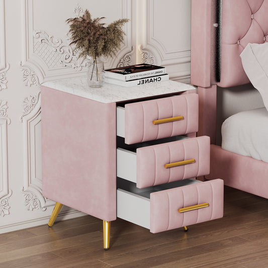 Pink velvet nightstand with three drawers and gold hardware