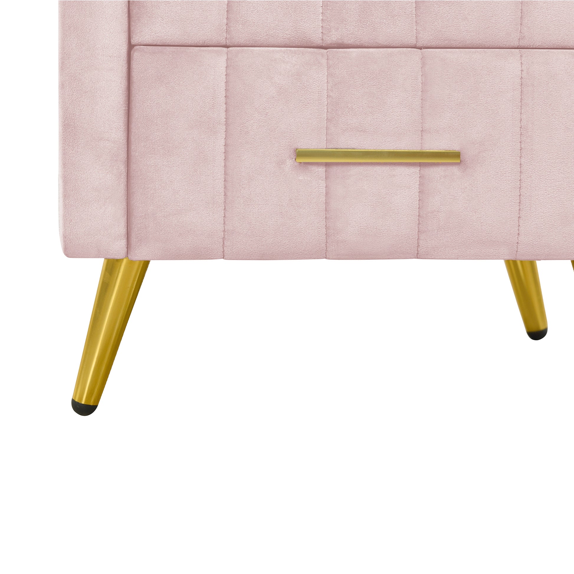 Closeup of a pink velvet dresser drawer with gold handle and tapered legs