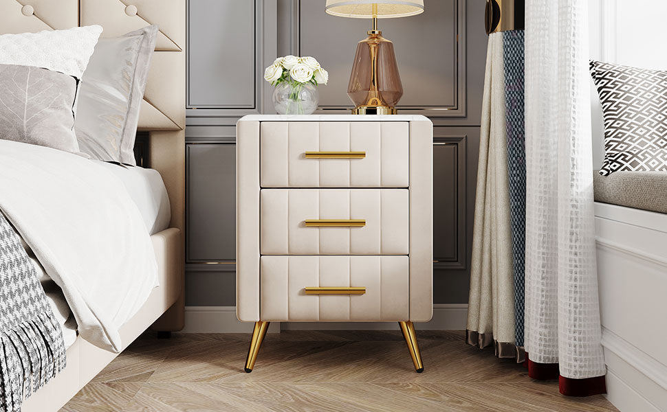 Cream velvet drawer nightstand with gold hardware and tapered legs