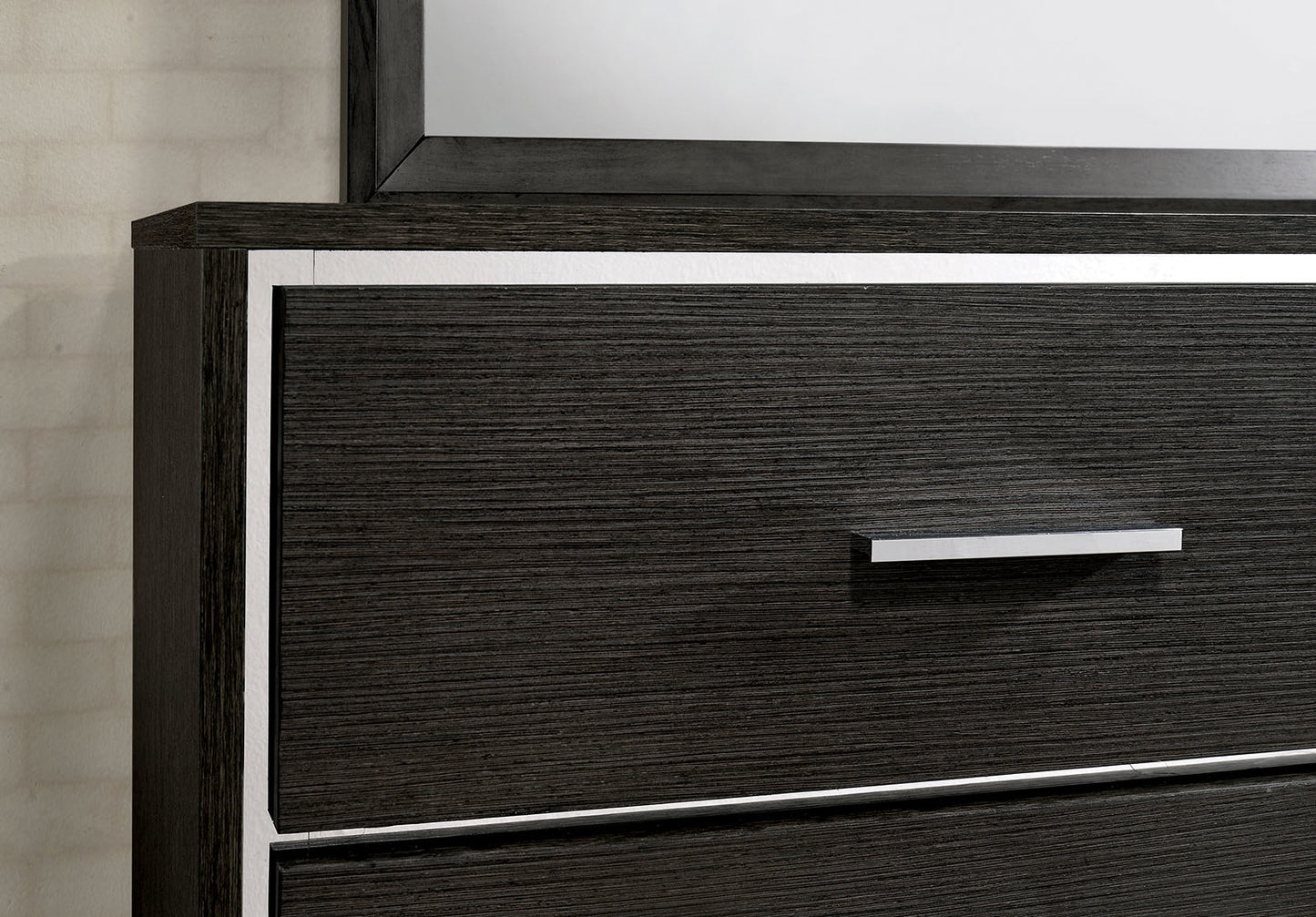 Dark wood dresser with silver trim and drawer pull