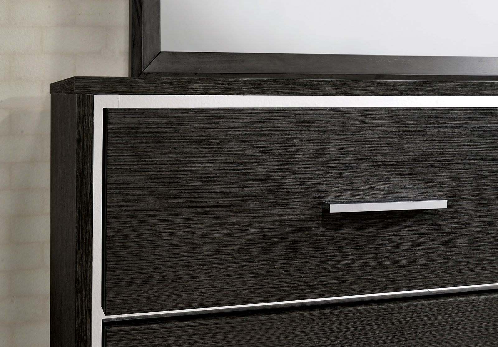 Dark wood dresser with silver trim and drawer pull