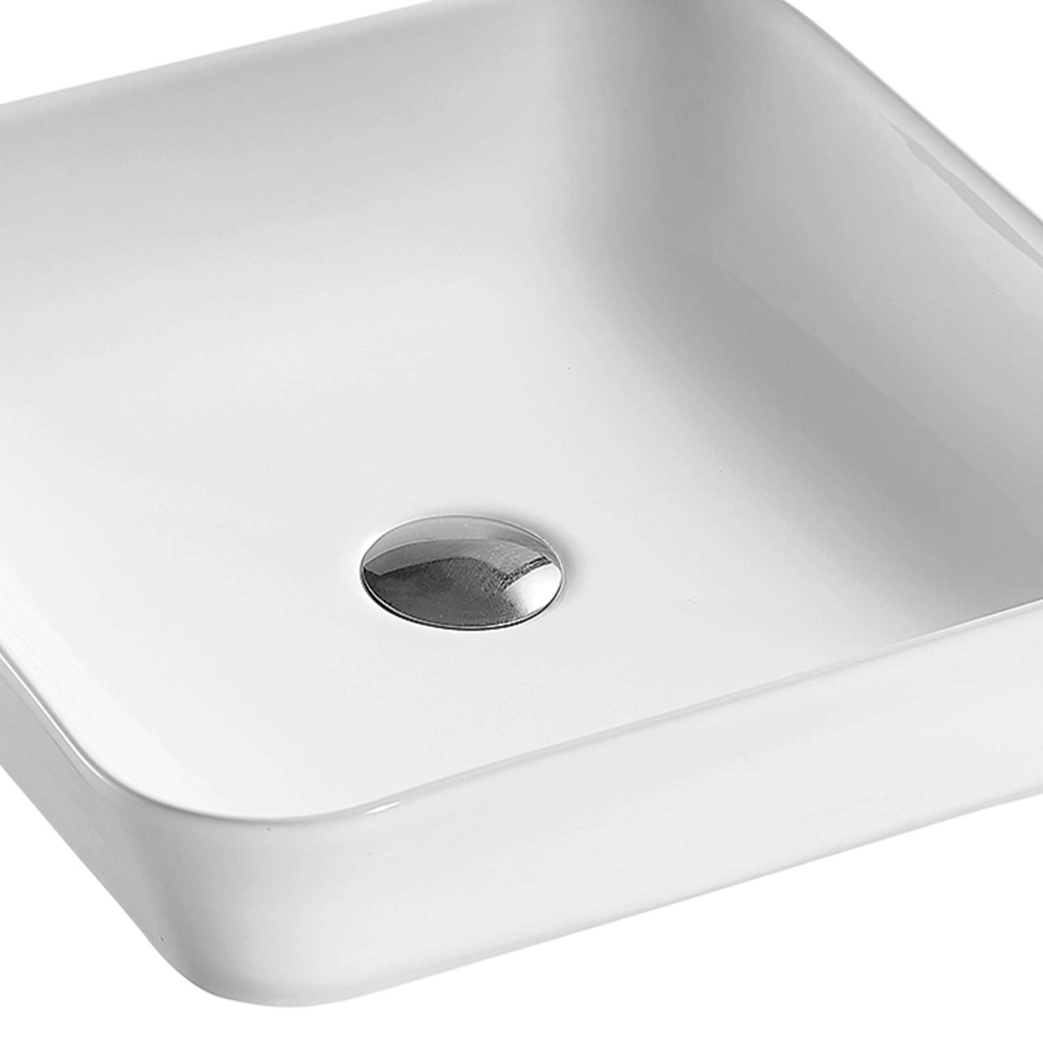 White ceramic vessel sink with polished chrome drain