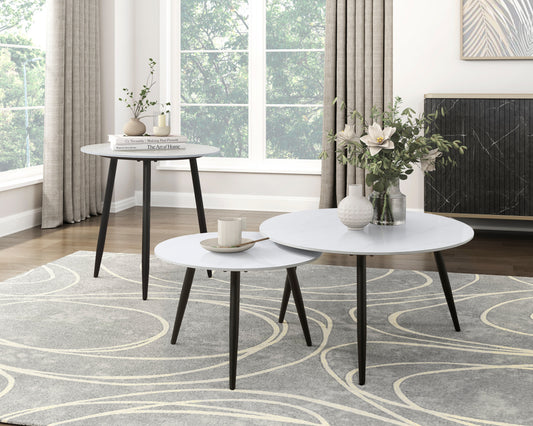White marblelook round coffee table set with black tapered legs