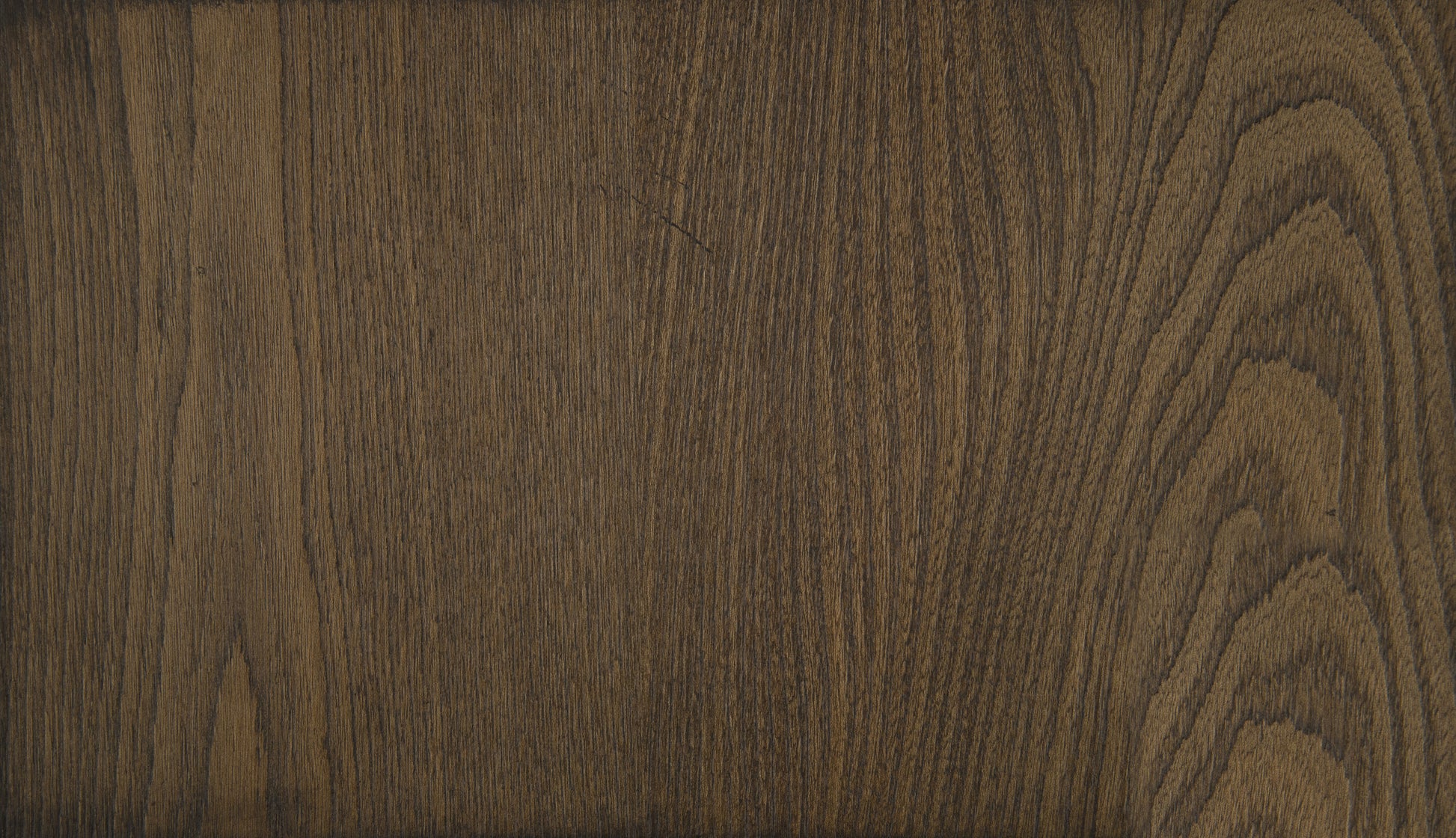 Dark brown oak wood veneer with prominent grain for furniture surfaces