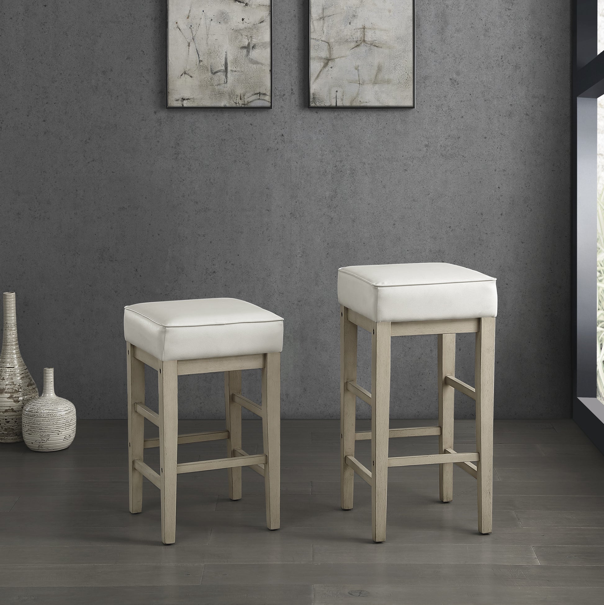 White leather padded backless counter stool with light wood legs
