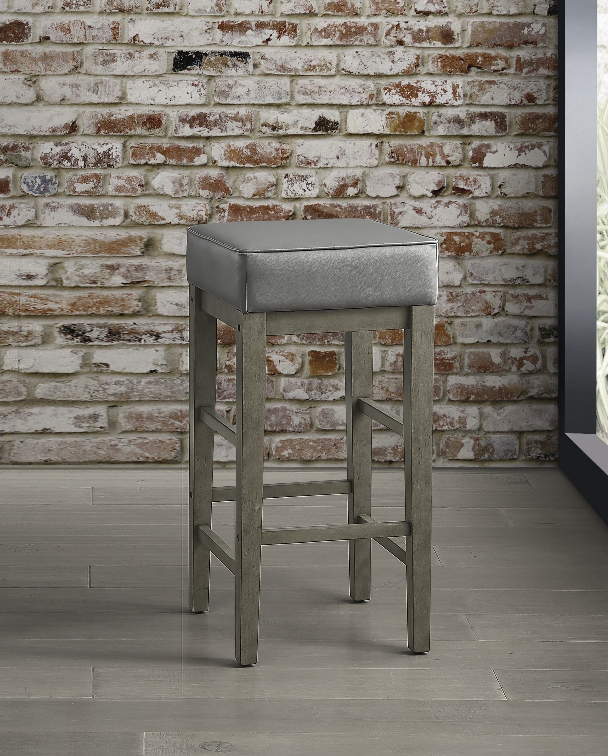 Gray upholstered square seat bar stool with distressed wood legs perfect for modern kitchens