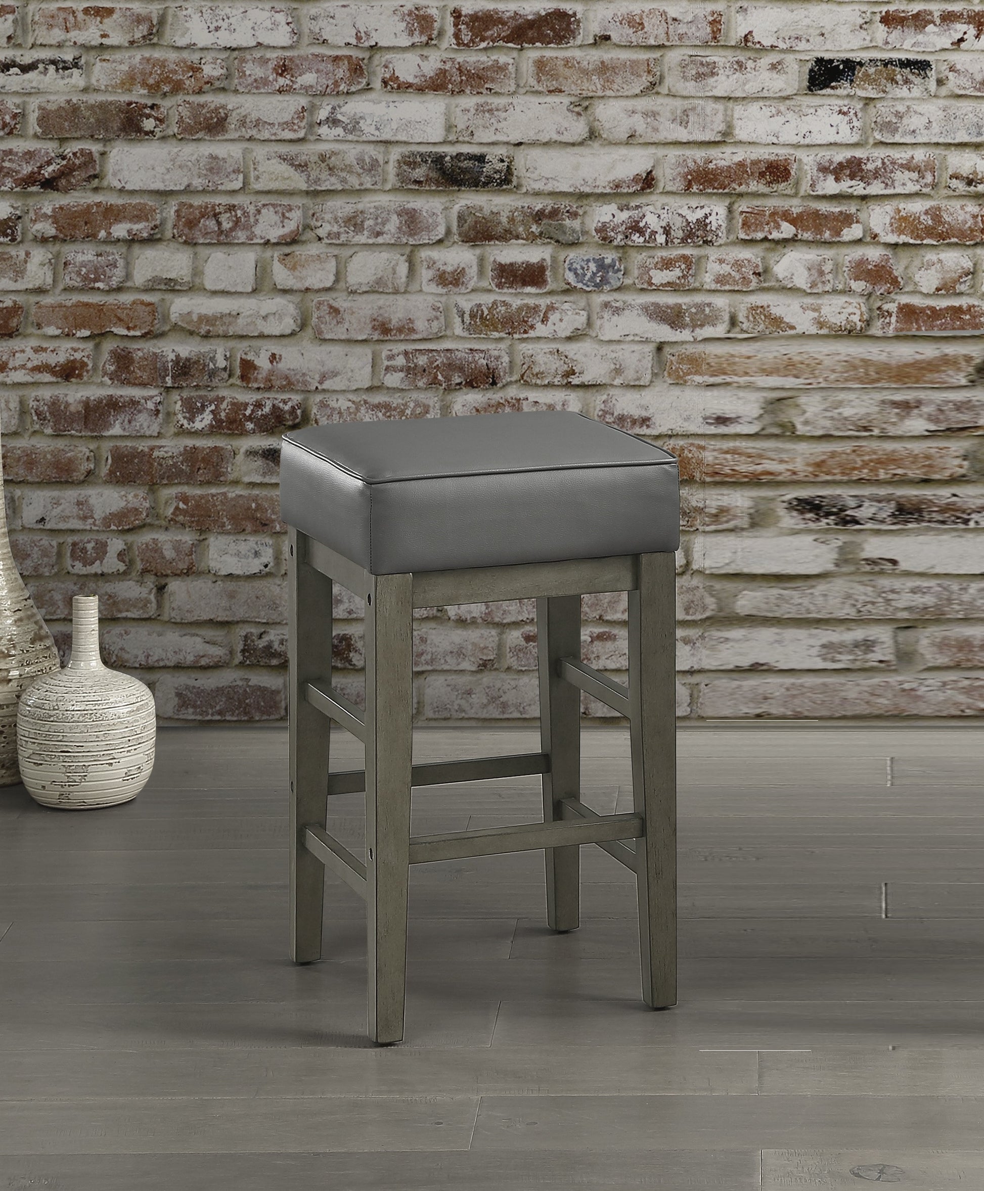 Gray faux leather square seat bar stool with distressed wood legs