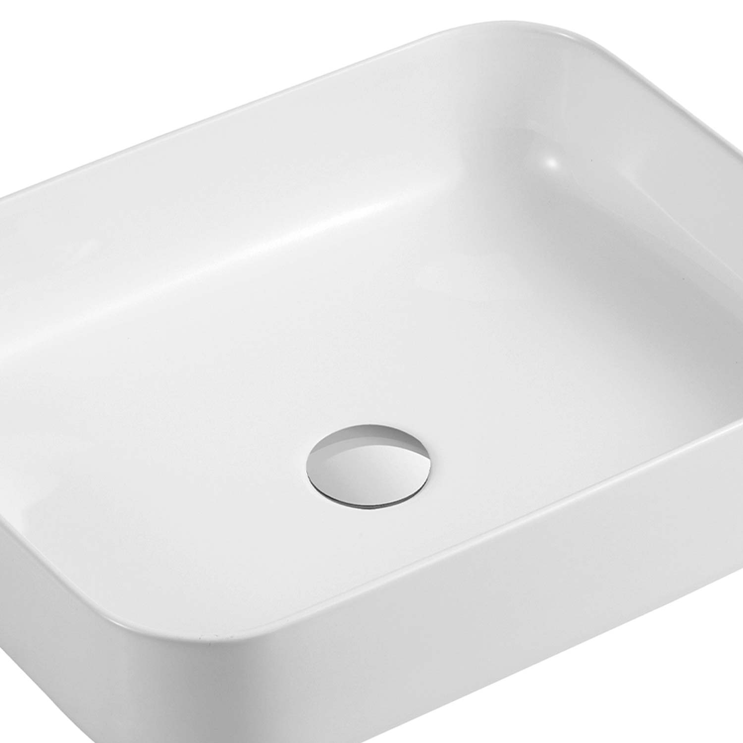 Rectangular white ceramic vessel sink with smooth rounded edges for a modern bathroom