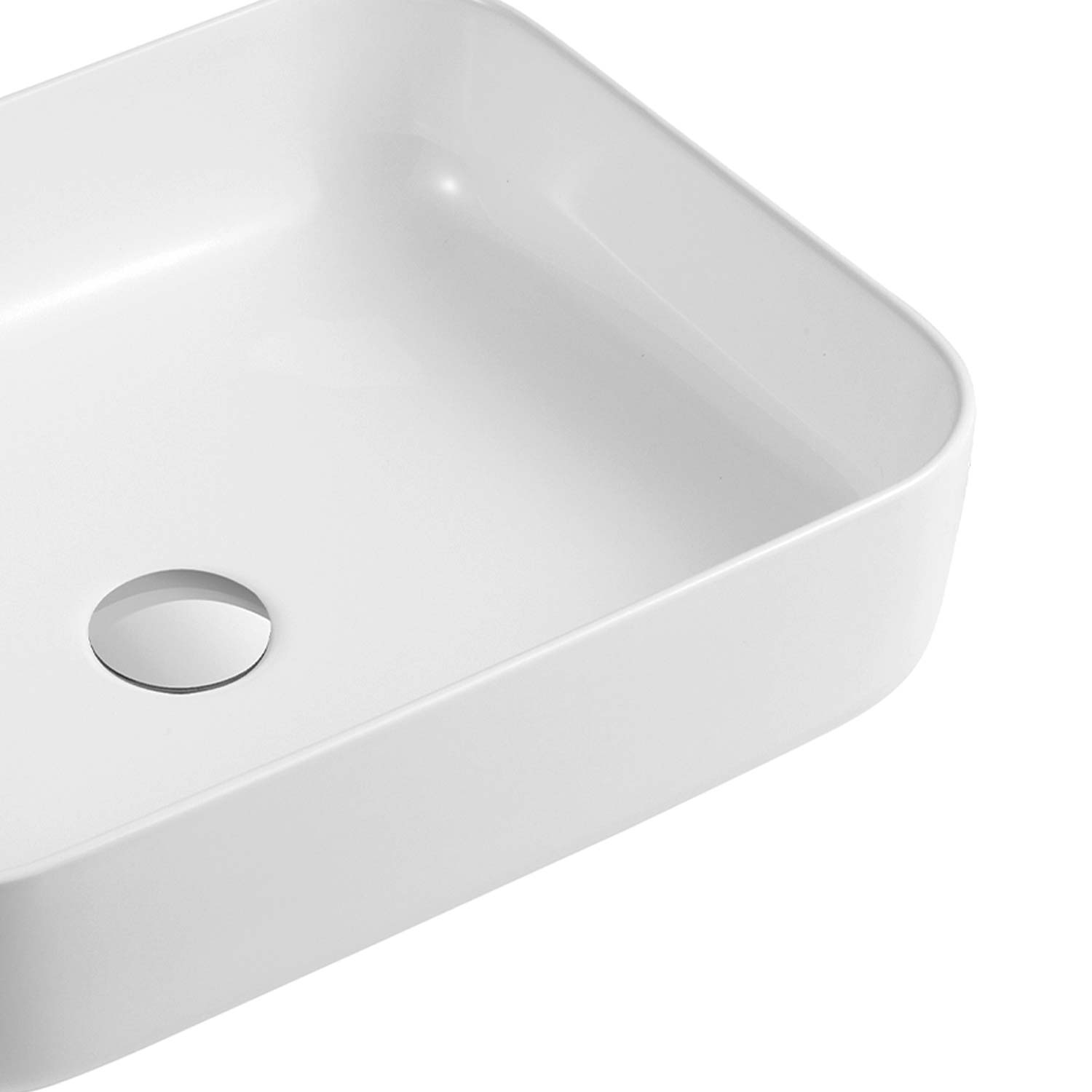 White rectangular ceramic vessel sink with smooth finish and drainage hole