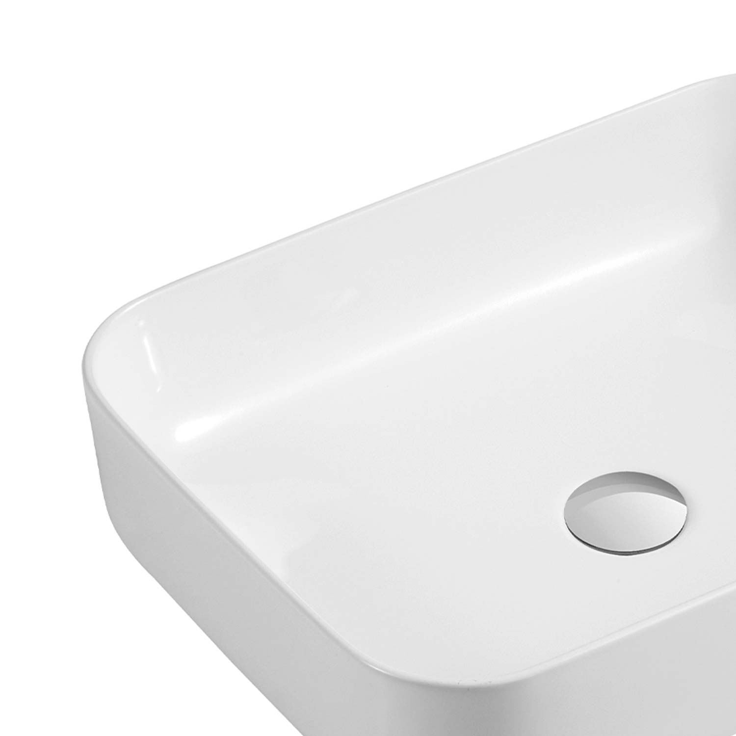 White ceramic vessel sink with clean modern lines and drain hole