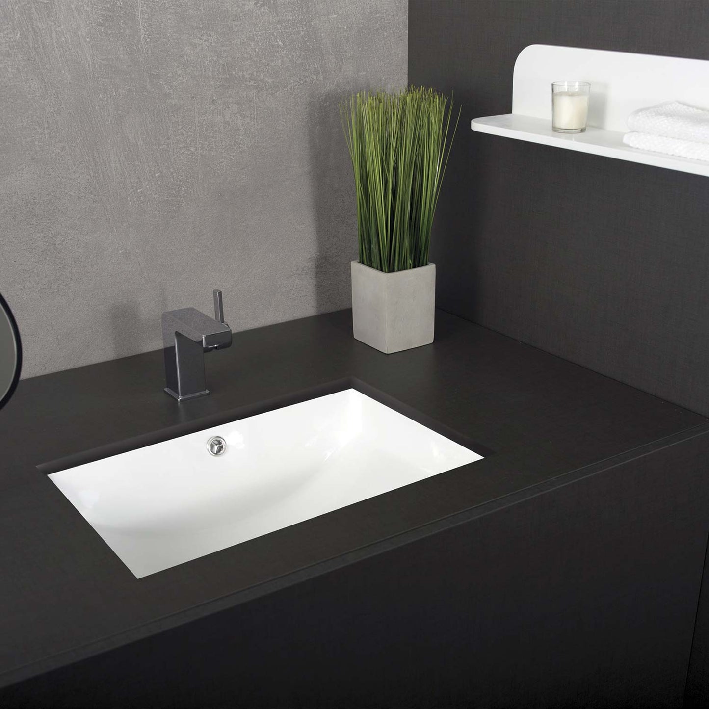Modern white rectangular bathroom sink with chrome faucet on dark vanity