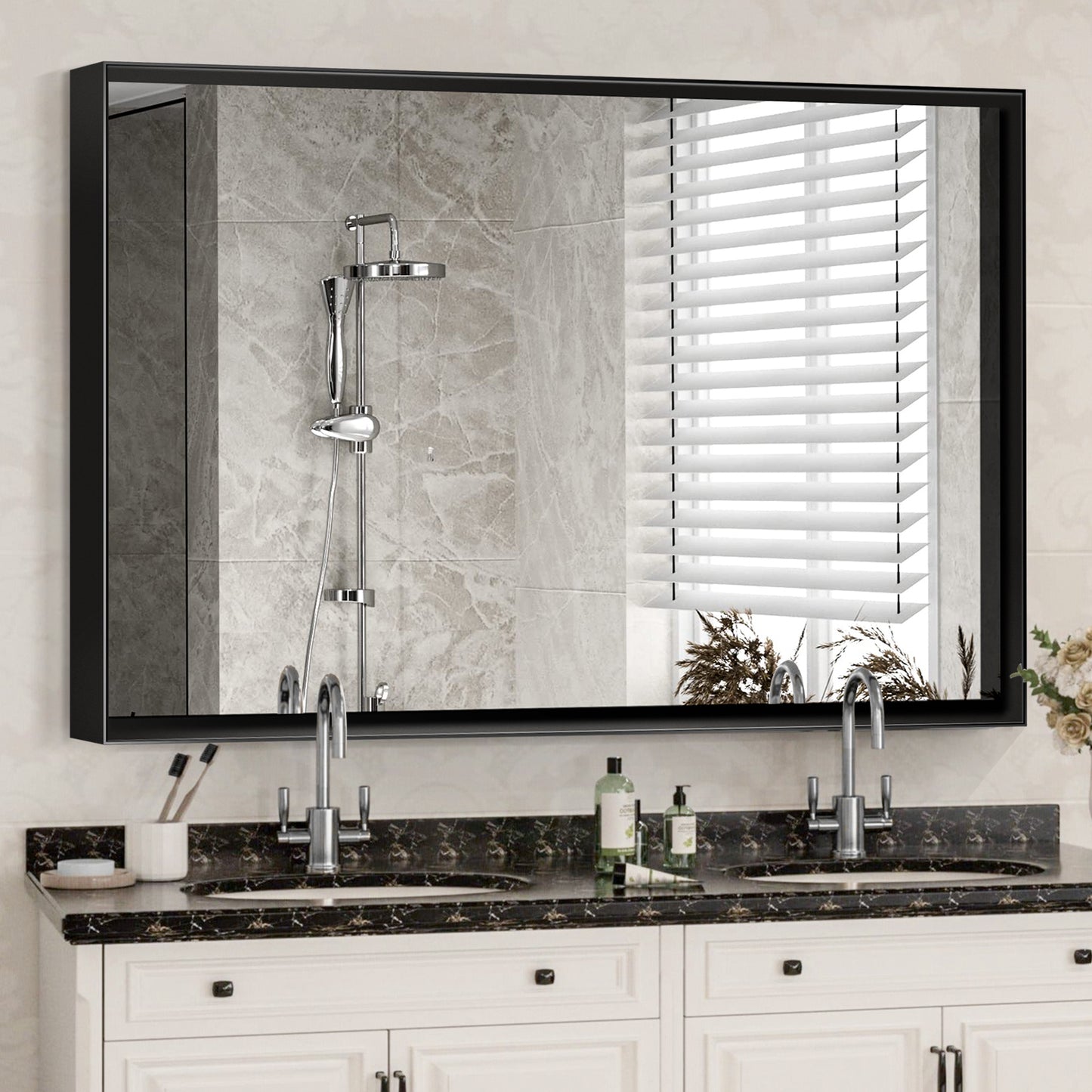 Modern black framed bathroom vanity mirror with dual sinks and marble countertop