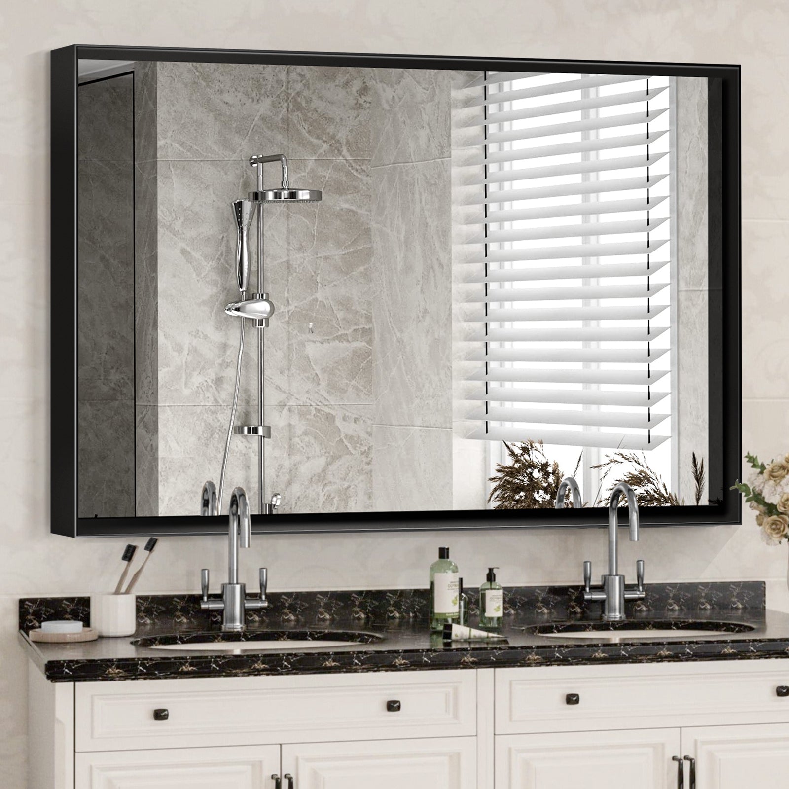 Modern black framed bathroom vanity mirror with dual sinks and marble countertop