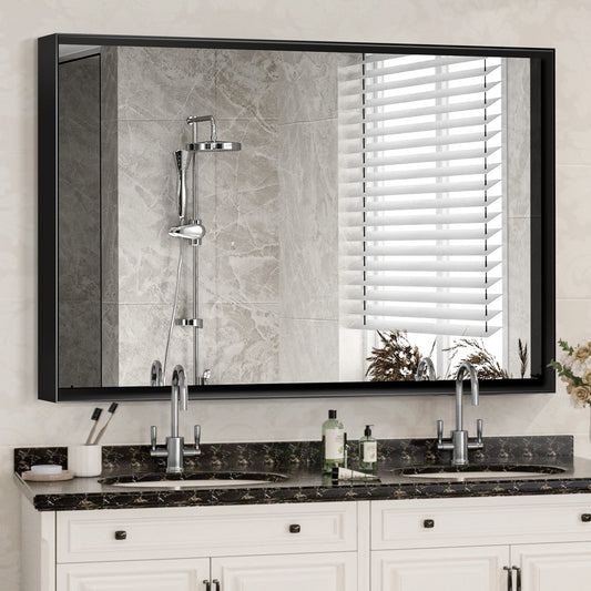 Modern black framed bathroom vanity mirror with dual sinks and marble countertop
