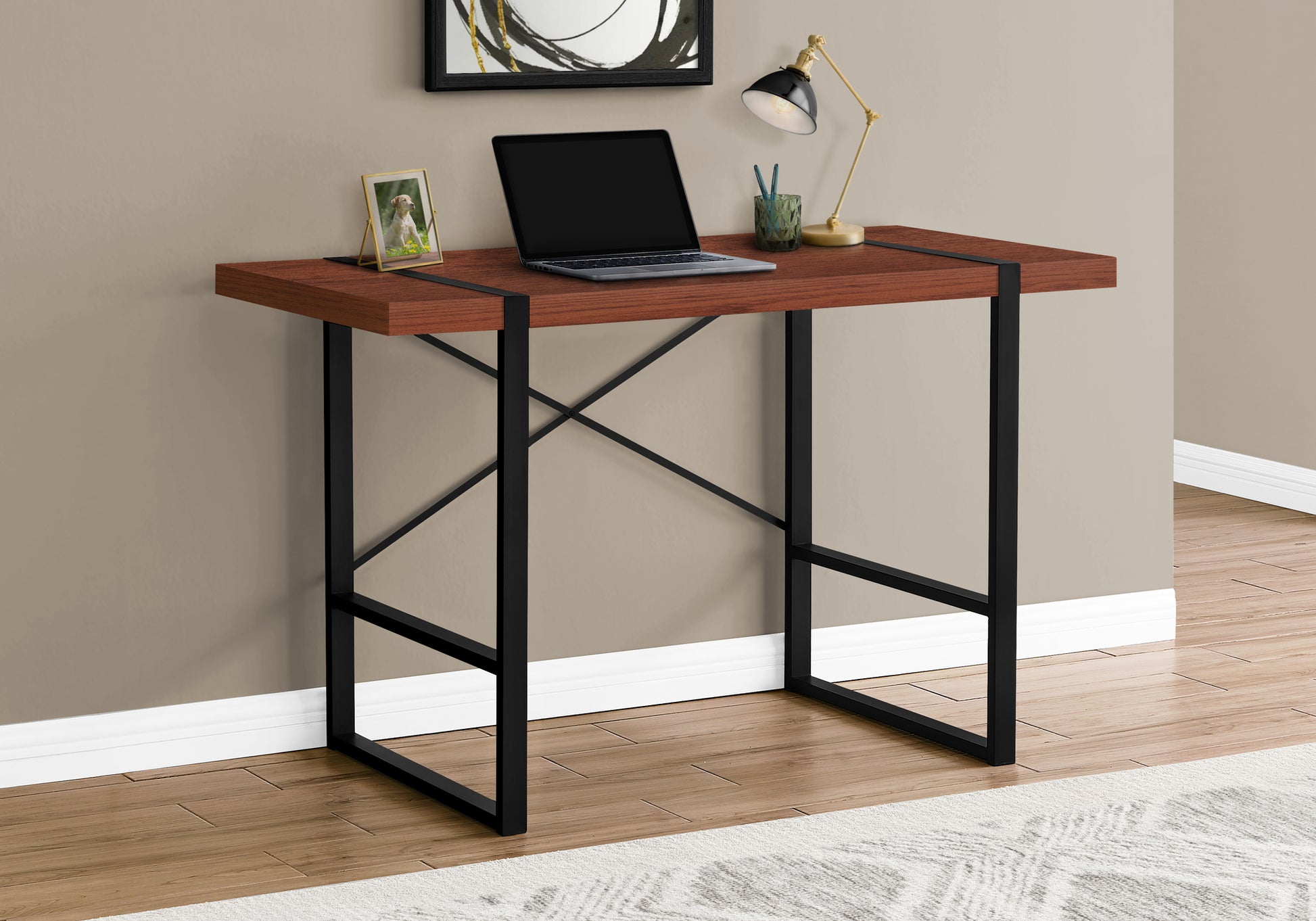 Modern walnut wood desk with black metal frame laptop and lamp