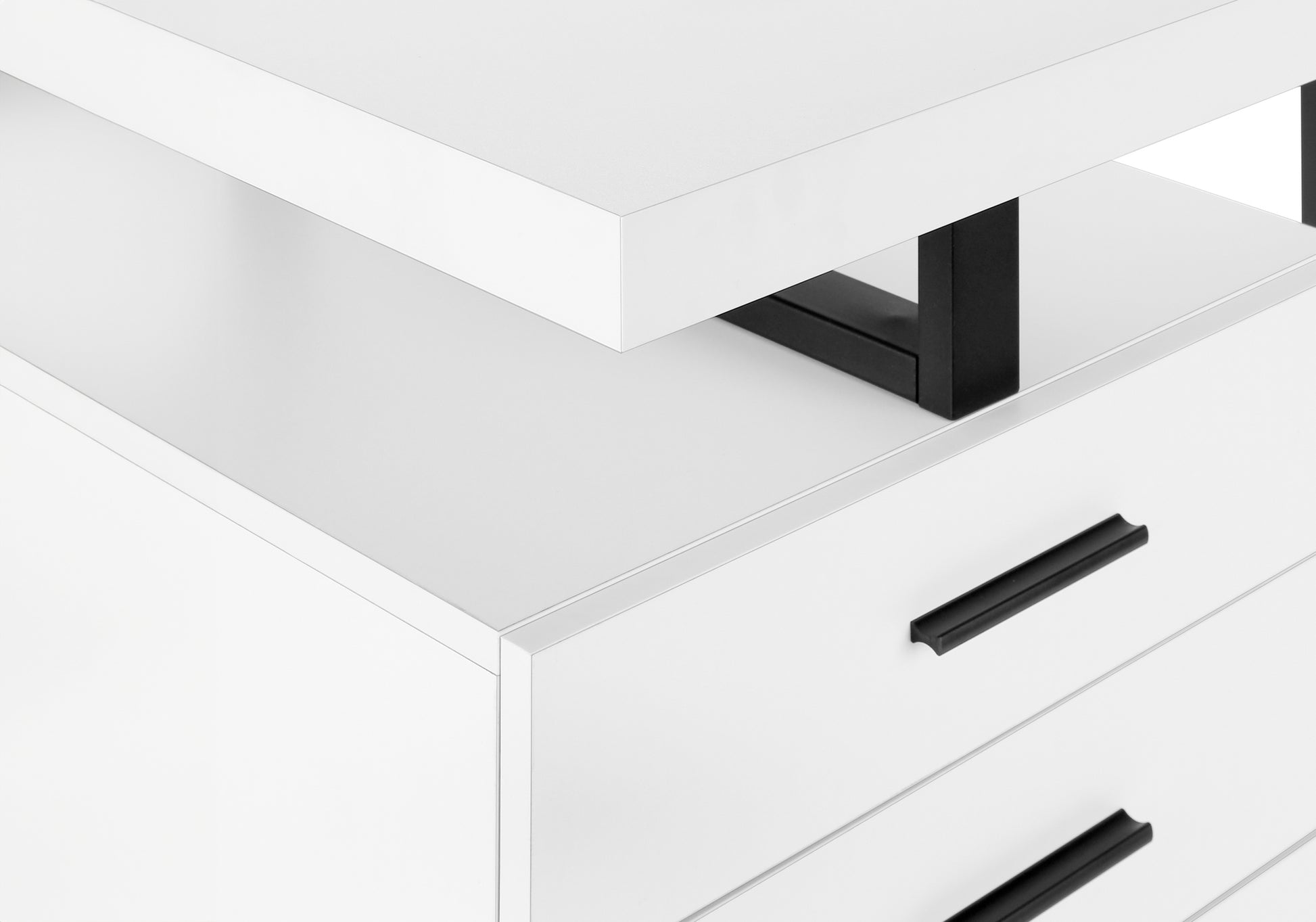 Closeup of white modern dresser with black drawer pulls and metal legs