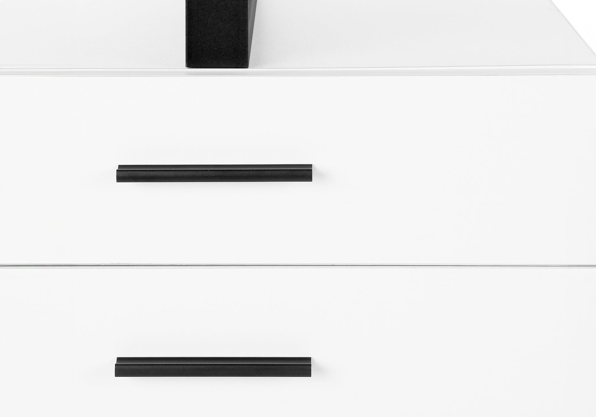 White dresser with two drawers featuring sleek black bar handles for modern storage