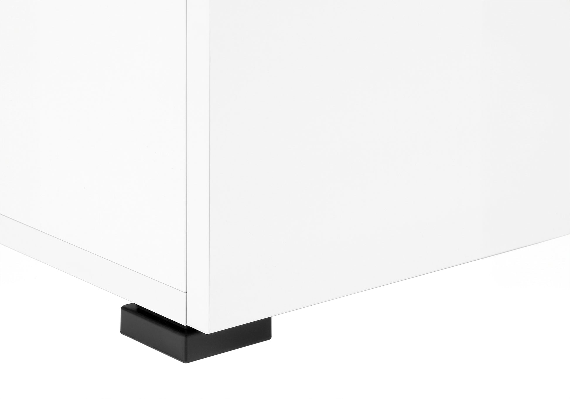 White modern cabinet corner with black furniture foot