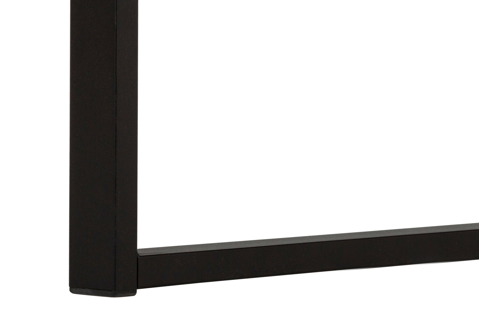 Closeup of black metal table legs with a textured finish