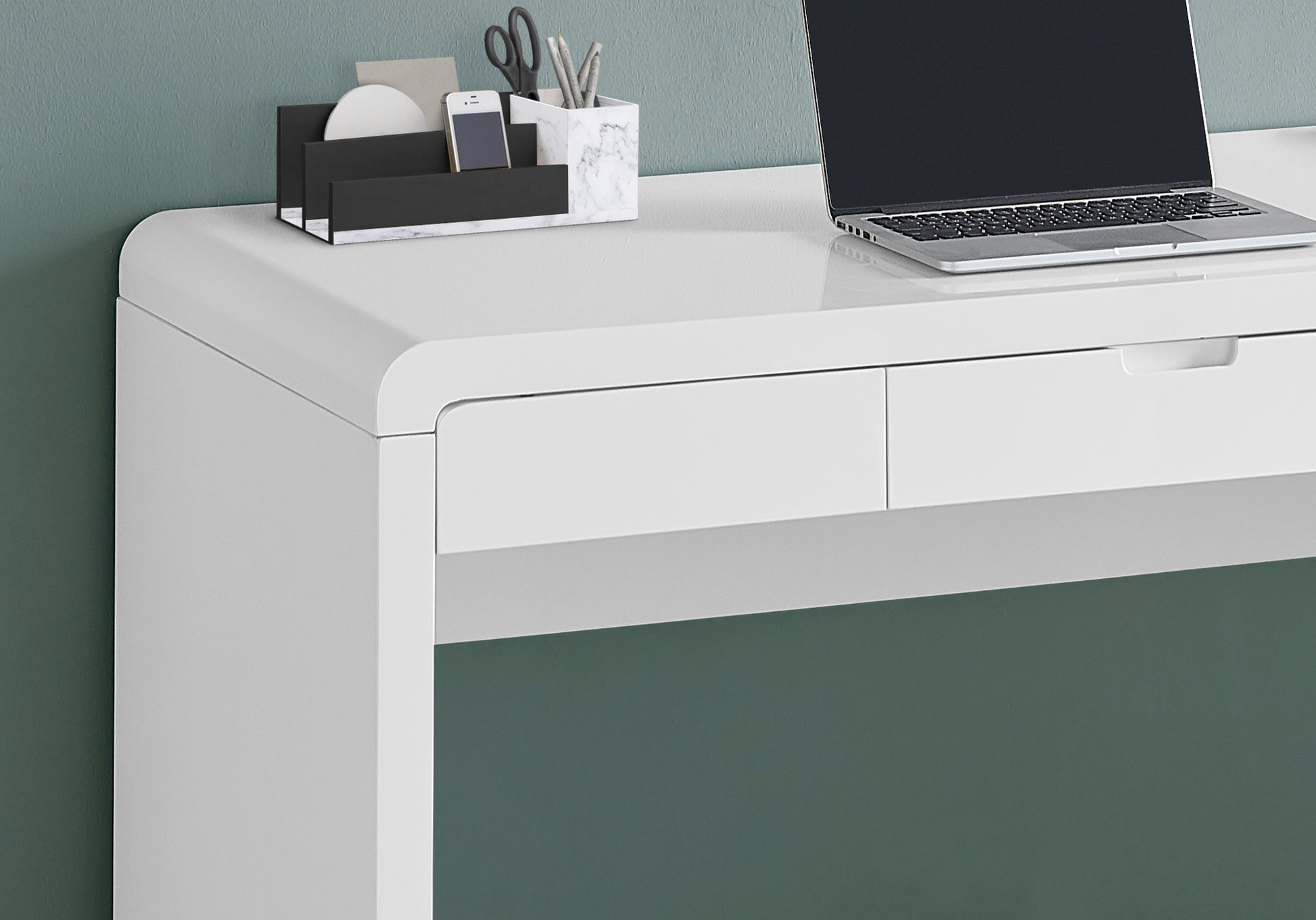 Modern white desk with sleek drawer and integrated laptop perfect for home office