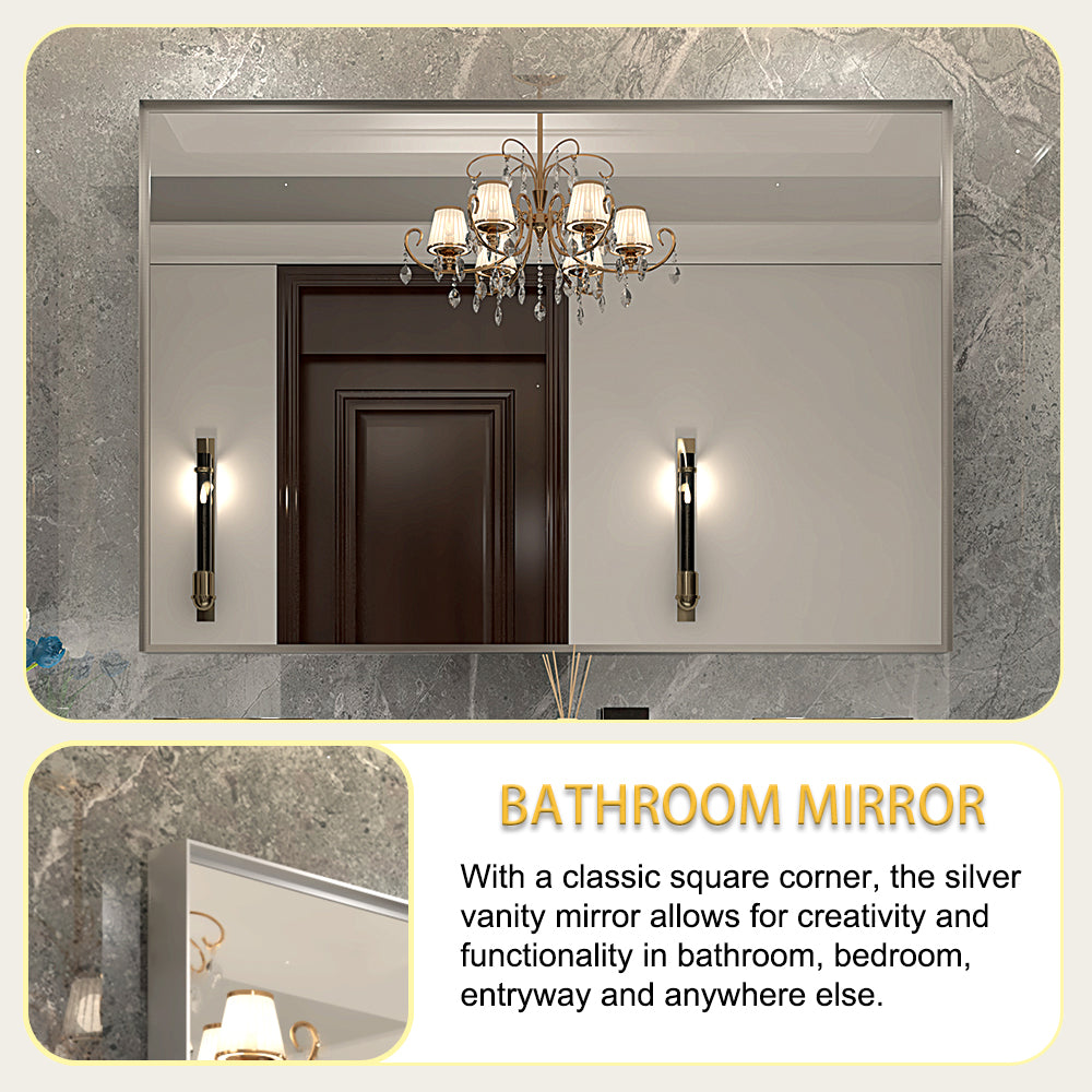 Rectangular silver vanity mirror with modern sconces and chandelier reflection