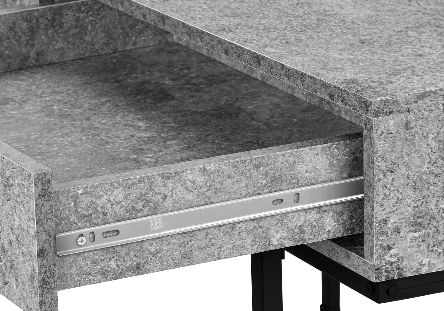 Close up of a gray stoneeffect drawer with metal slides on a modern desk