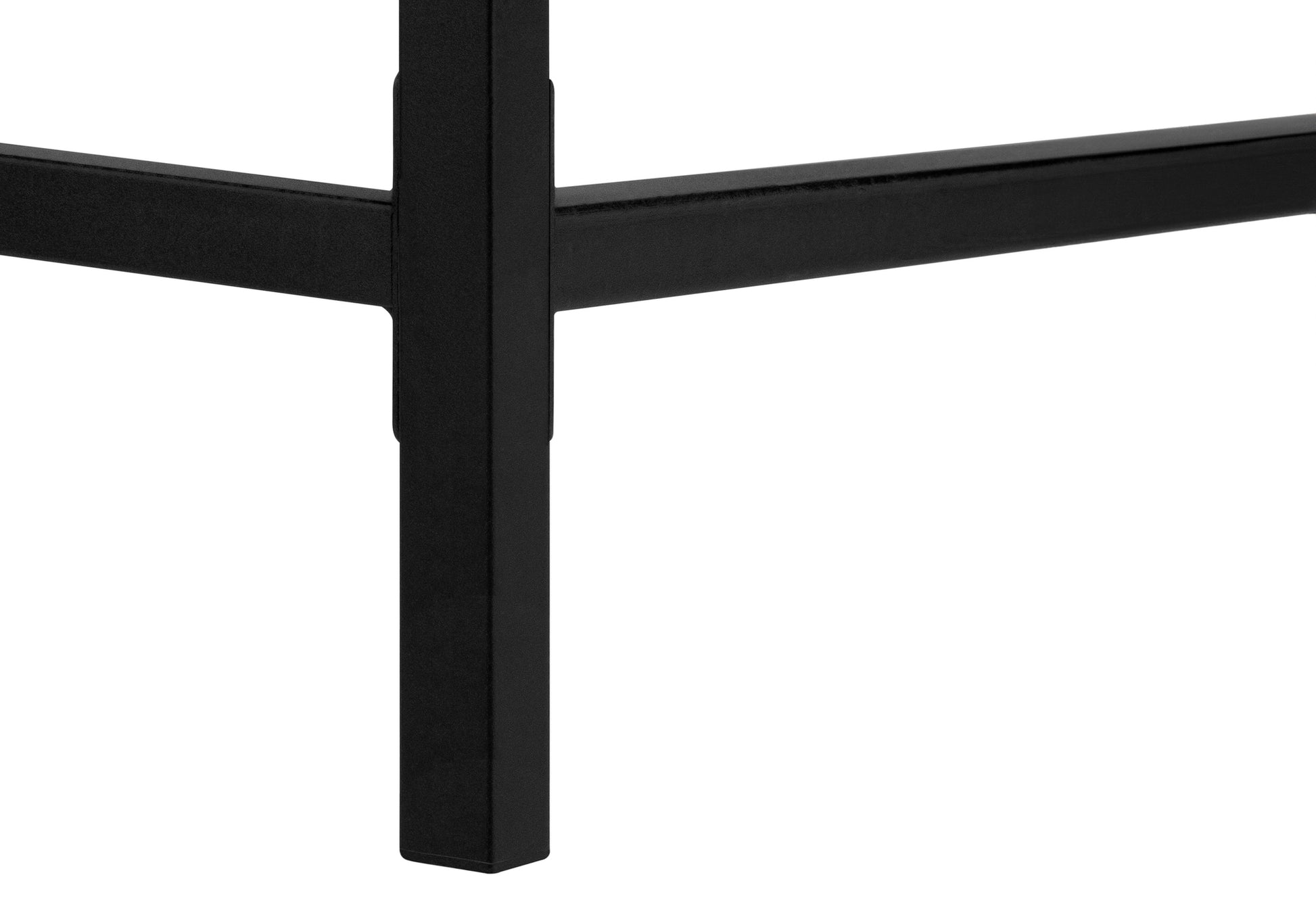 Closeup of matte black metal table legs with sturdy square framing  characters