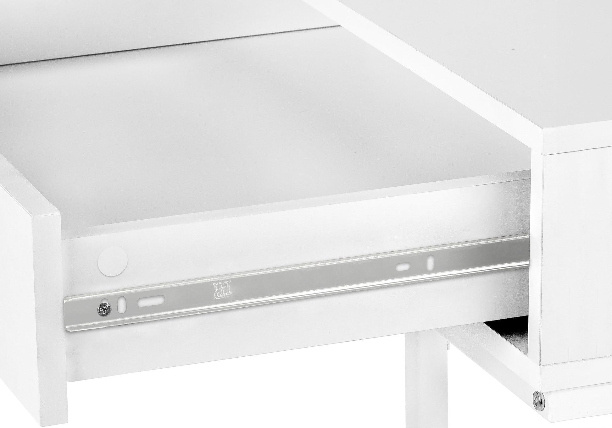 Closeup of a white desk drawer interior with metal drawer slides