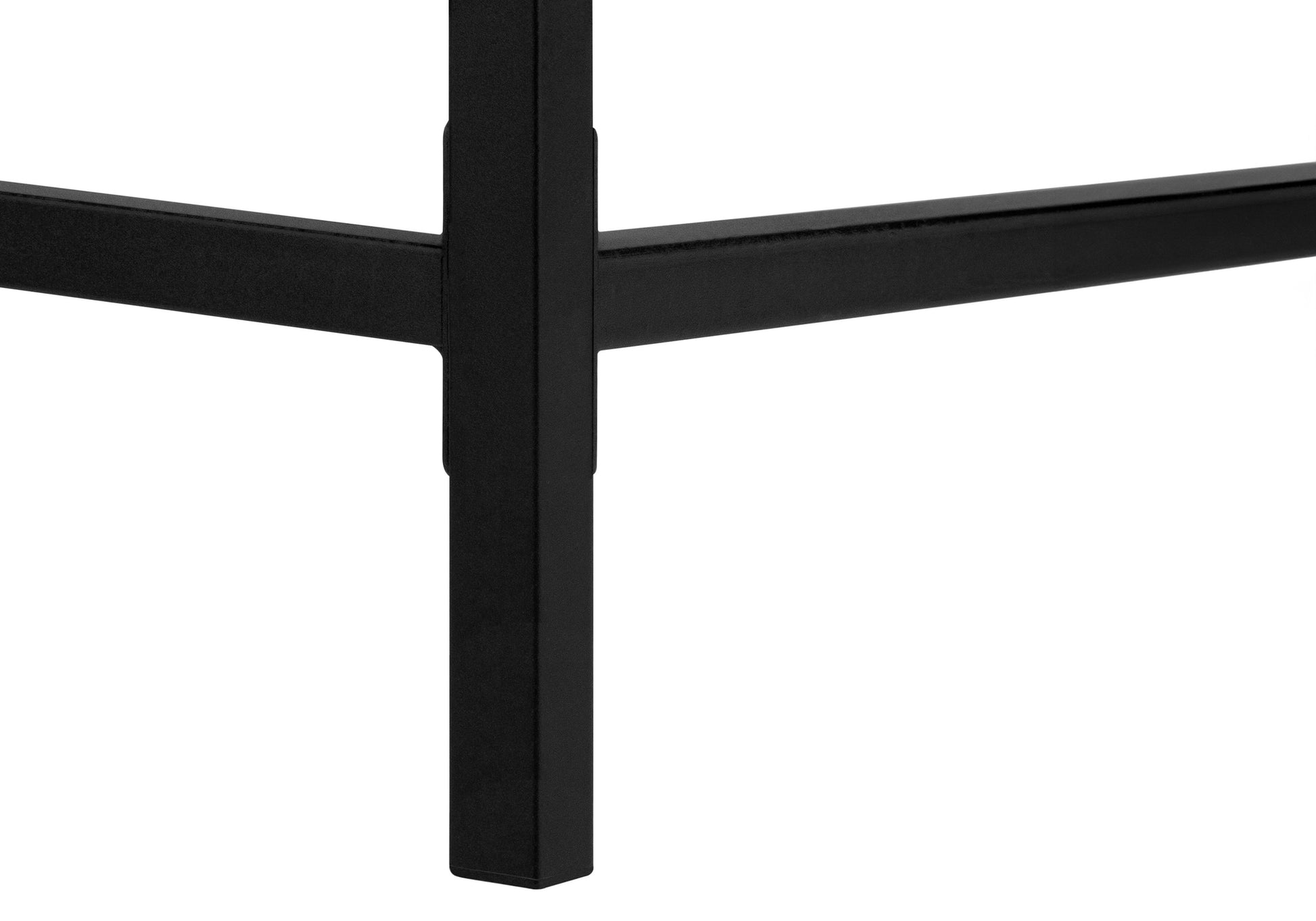 Closeup of a matte black metal table leg showcasing its sturdy minimalist design