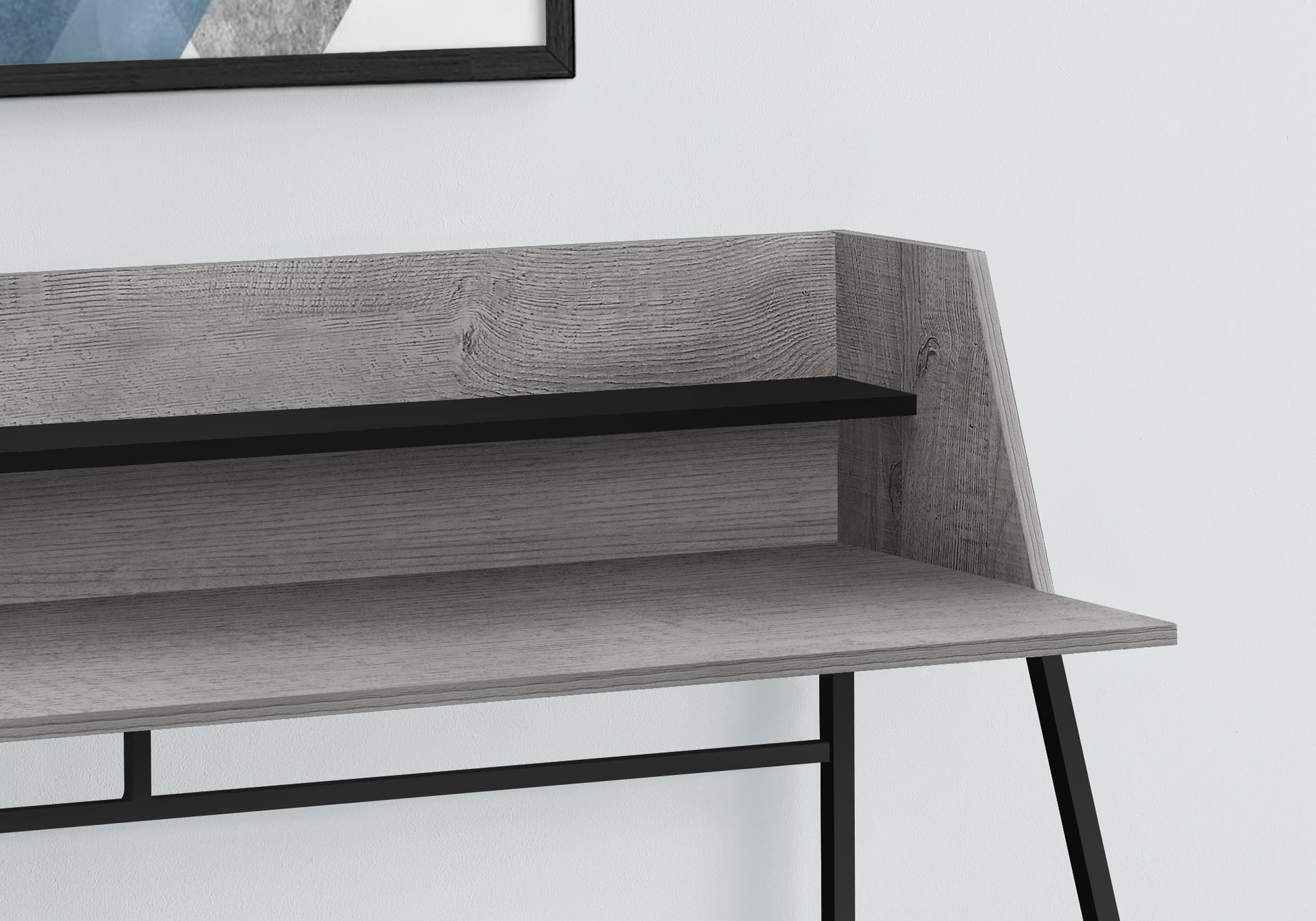 Grey wood secretary desk with black metal legs and minimalist design