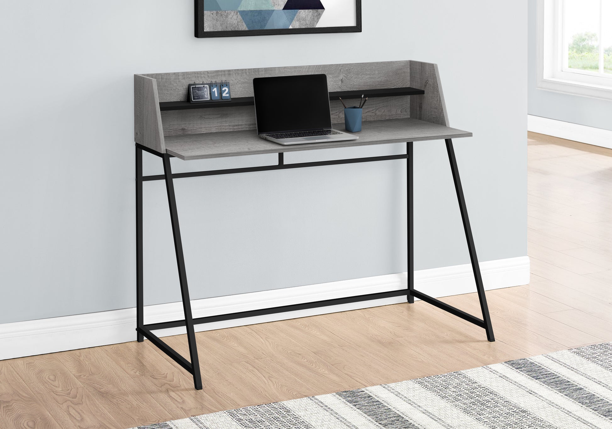 Grey wood secretary desk with black metal legs laptop and calendar