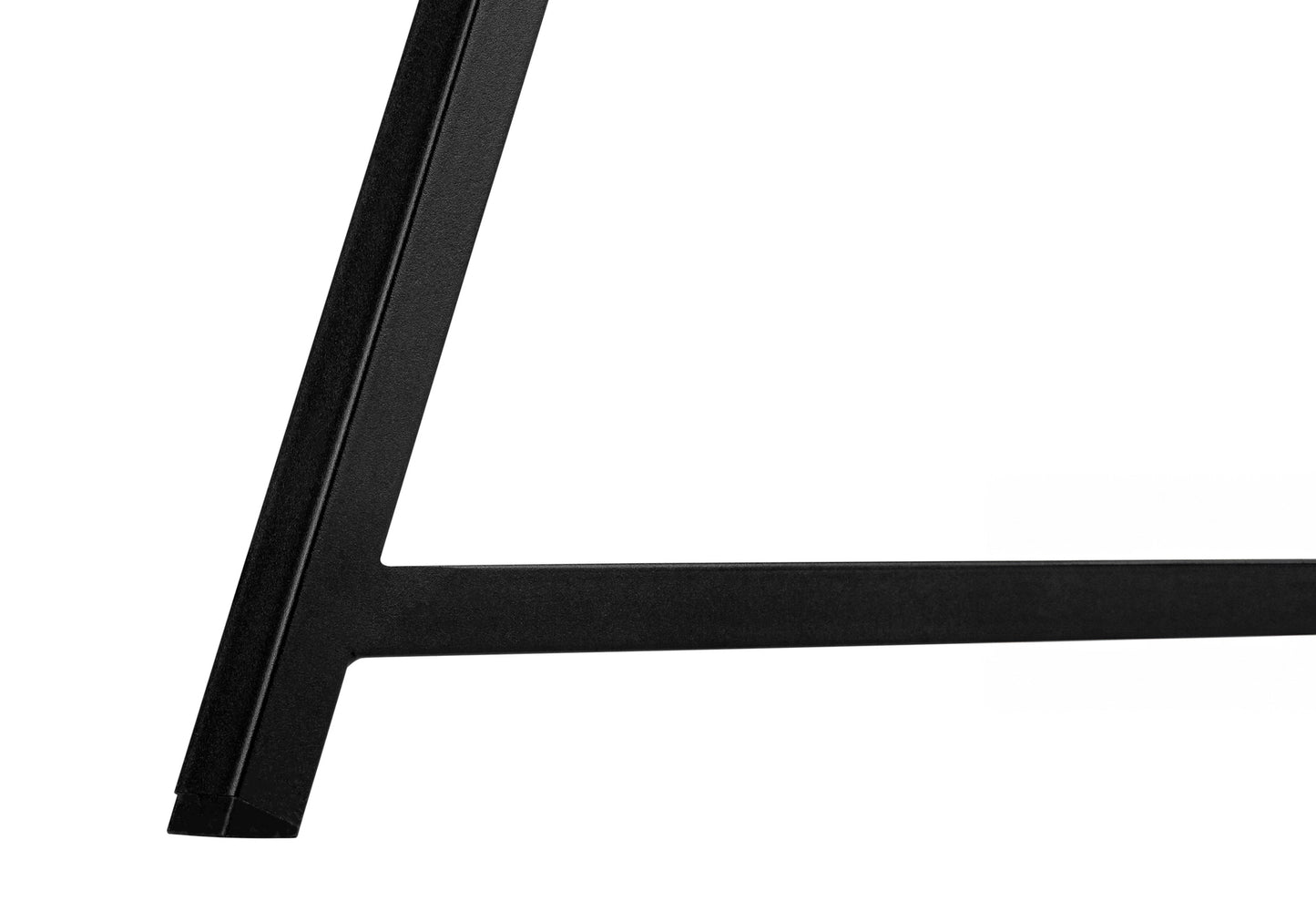 Closeup of matte black metal table leg with angular design