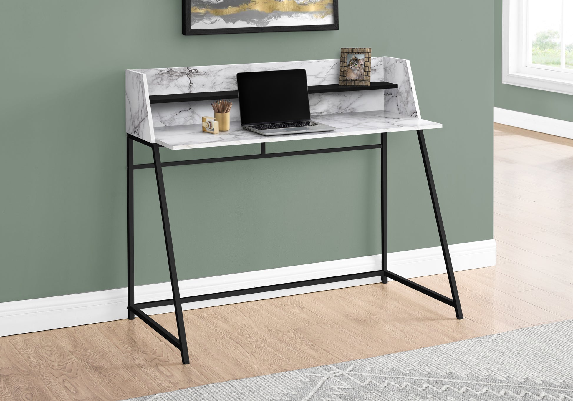 Modern marble print secretary desk with black metal legs and a laptop
