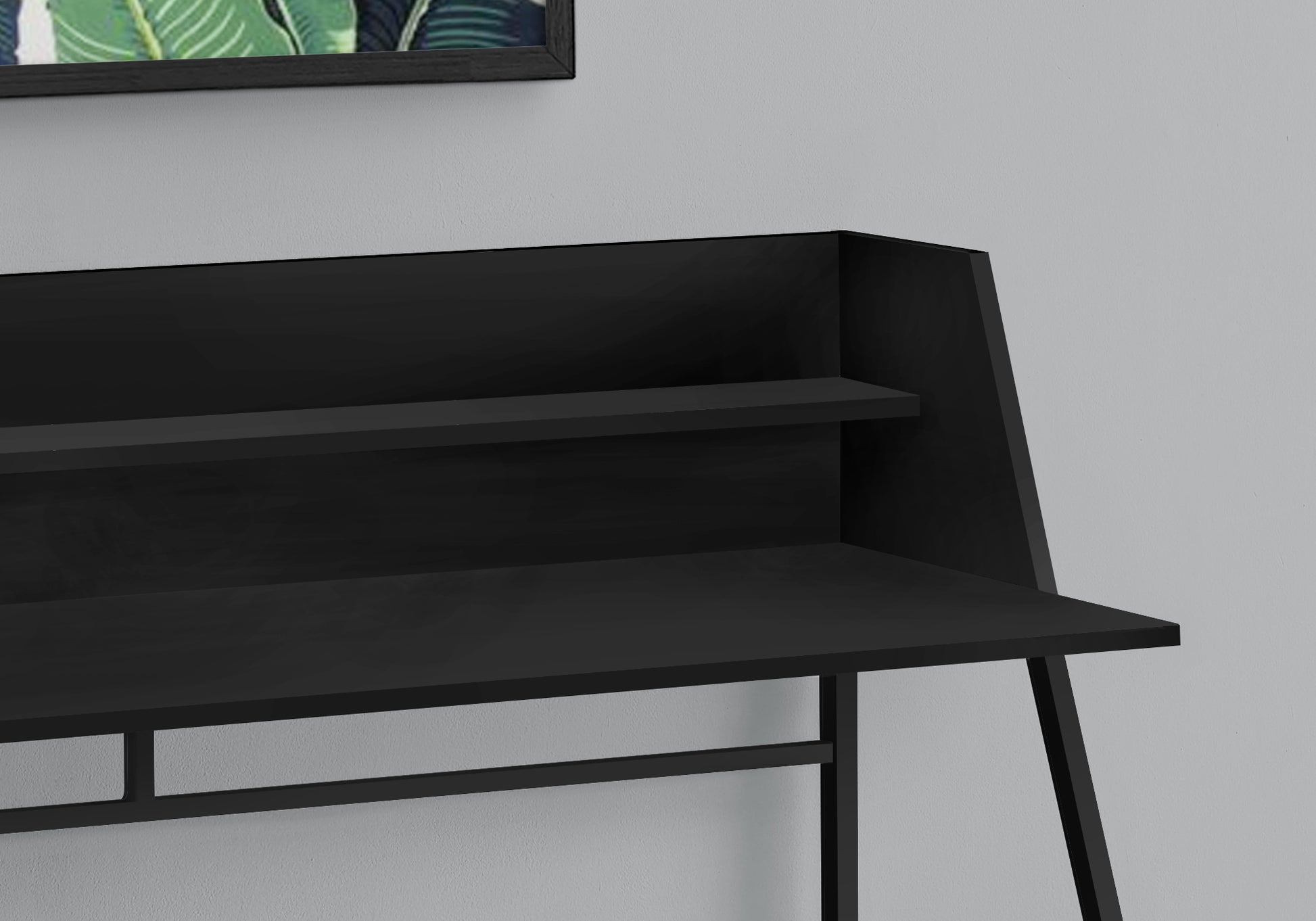 Modern black metal desk with two tiered shelves and an open workspace